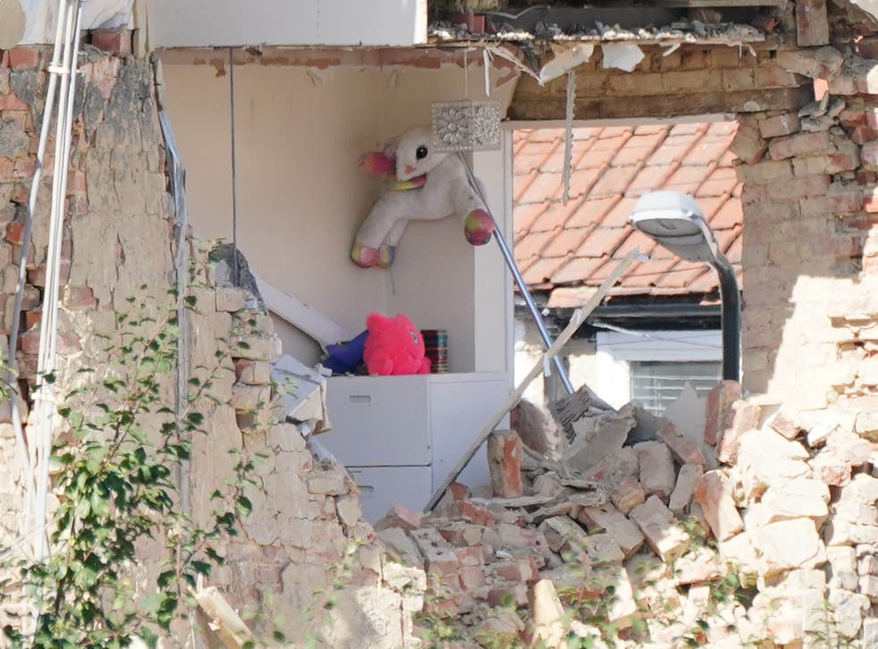 <p>Soft toys and a lampost are seen in an exposed room of a property in Galpin’s Road (Dominic Lipinski/PA)</p>