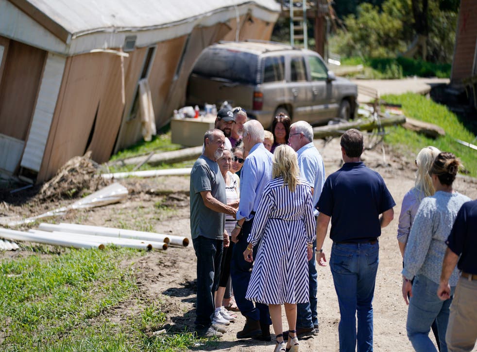 <p>President Joe Biden and first lady Jill Biden and others, tour a neighborhood impacted by flooding, Monday, August 8, 2022, in Lost Creek, Kentucky</p>