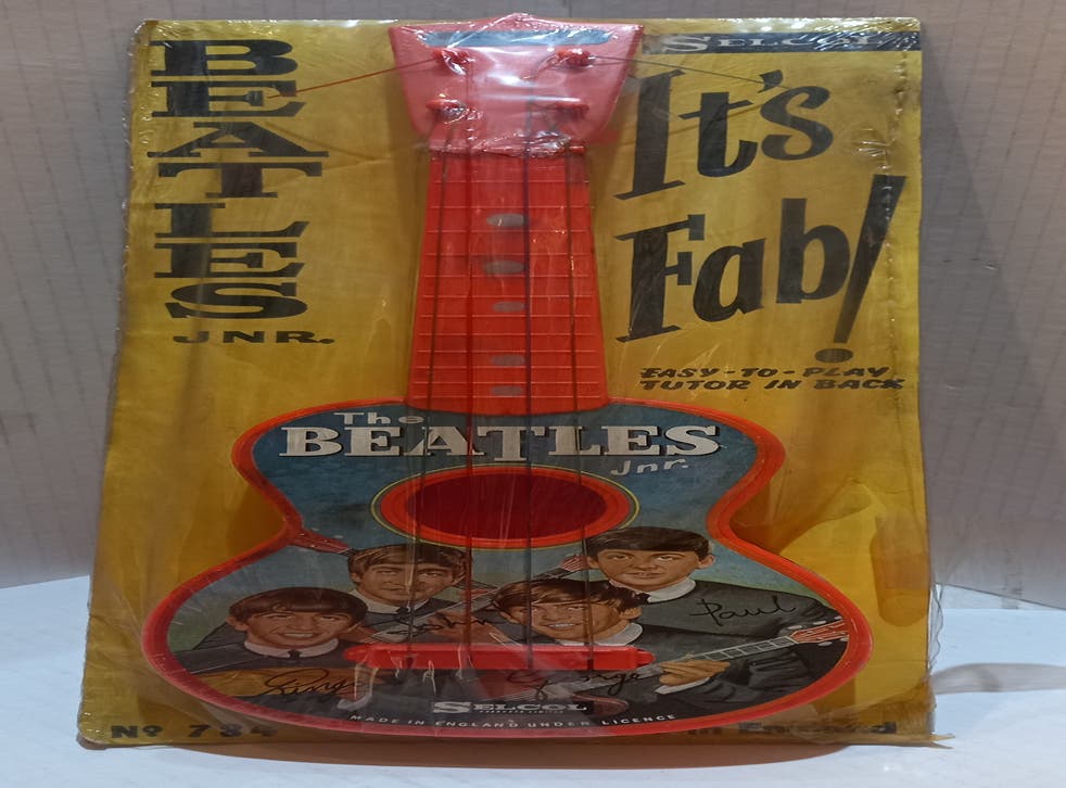 A Beatles Jnr Guitar, the size of a ukukele, will go sale (The Beatles Shop/PA)