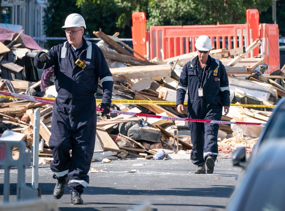 Engineers at the scene of the explosion on Galpin’s Road in Thornton Heath (Dominc Lipinski/PA)