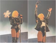 Lady Gaga gets hit in the head with a flying object and carries on performing