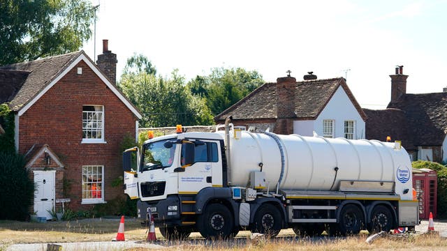 A tanker from Thames Water delivers a temporary water supply to the village of Northend in Oxfordshire, where the water company is pumping water into the supply network following a technical issue at Stokenchurch Reservoir