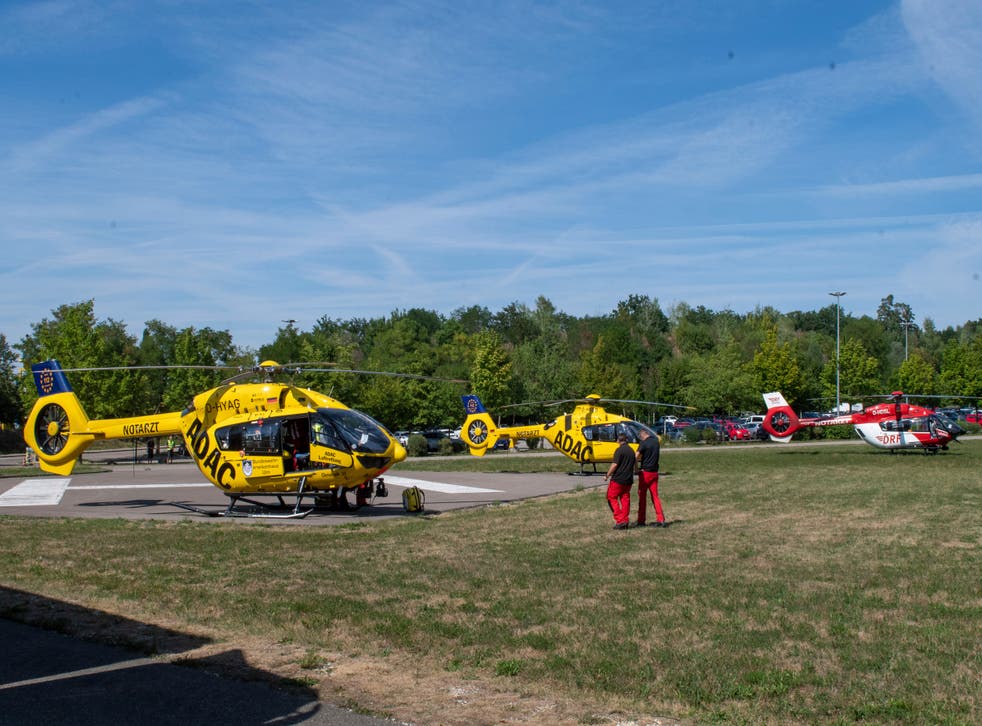 <p>Rescue helicopters are seen in a field near the 'Legoland' amusement park in Guenzburg</bl>