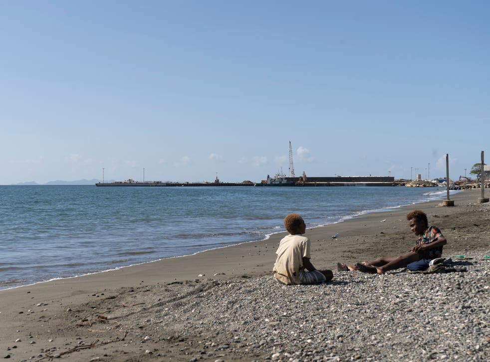 <p>Boys play near Leroy Wharf, a port outside Honiara that some opposition leaders and experts think China could use as a de facto base</s>