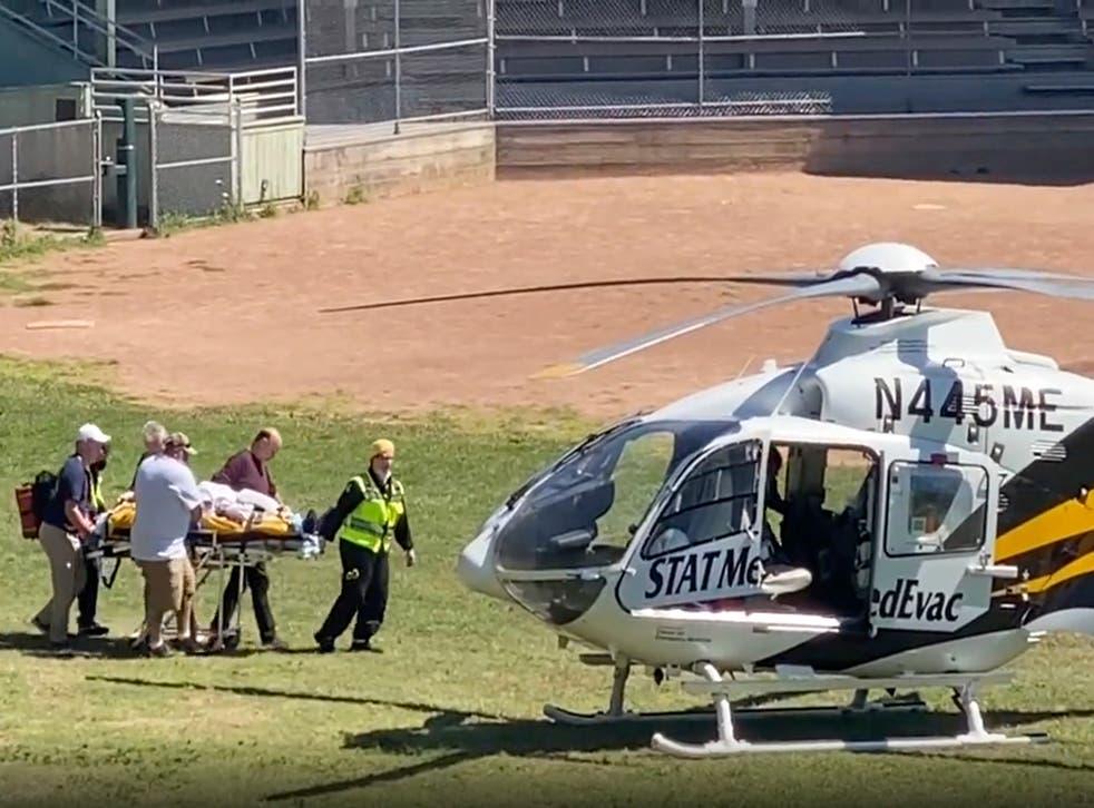 <p>In this still image from video, author Salman Rushdie is taken on a stretcher to a helicopter for transport to a hospital </磷>