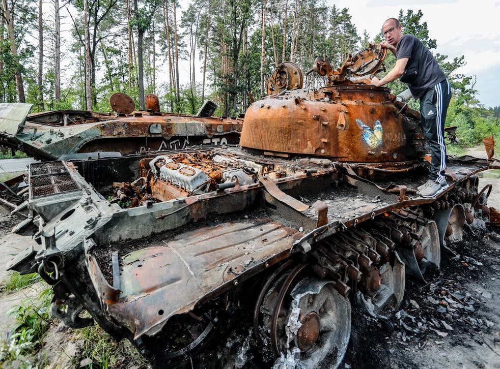 <p>A man surveys a destroyed Russian tank in Bucha Oblast. Moscow continues to bear down on Ukraine with ferocity especially in Donetsk, Luhansk, Kharkiv and Kherson</bl>