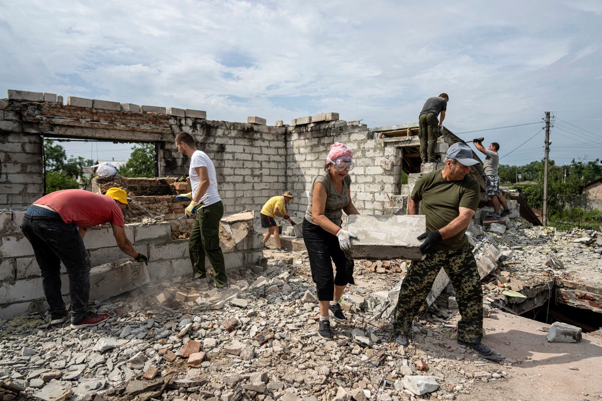 In Ukraine, rebuilding starts with neighbors' help
