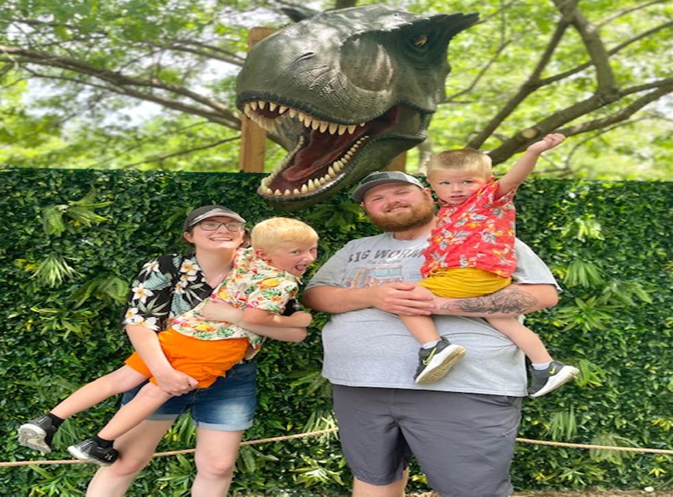 <p>Cassie Walton, 23, poses with her husband and their children; she has gone viral on social media after posting a video teaching her older son, Weston, what to do in case of a school shooter attack </p>