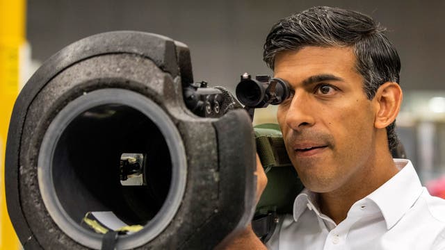 Rishi Sunak looks at a NLAW anti tank launcher, supplied to Ukraine, during a campaign visit to Thales Defence System plant in Belfast, as part of his campaign to be leader of the Conservative Party and the next prime minister