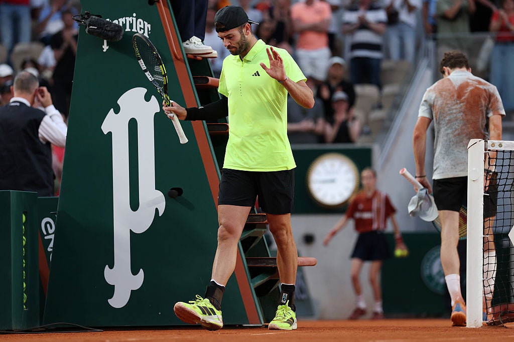 Fearnley holds up his hands after making it through to the French Open third round for the first time