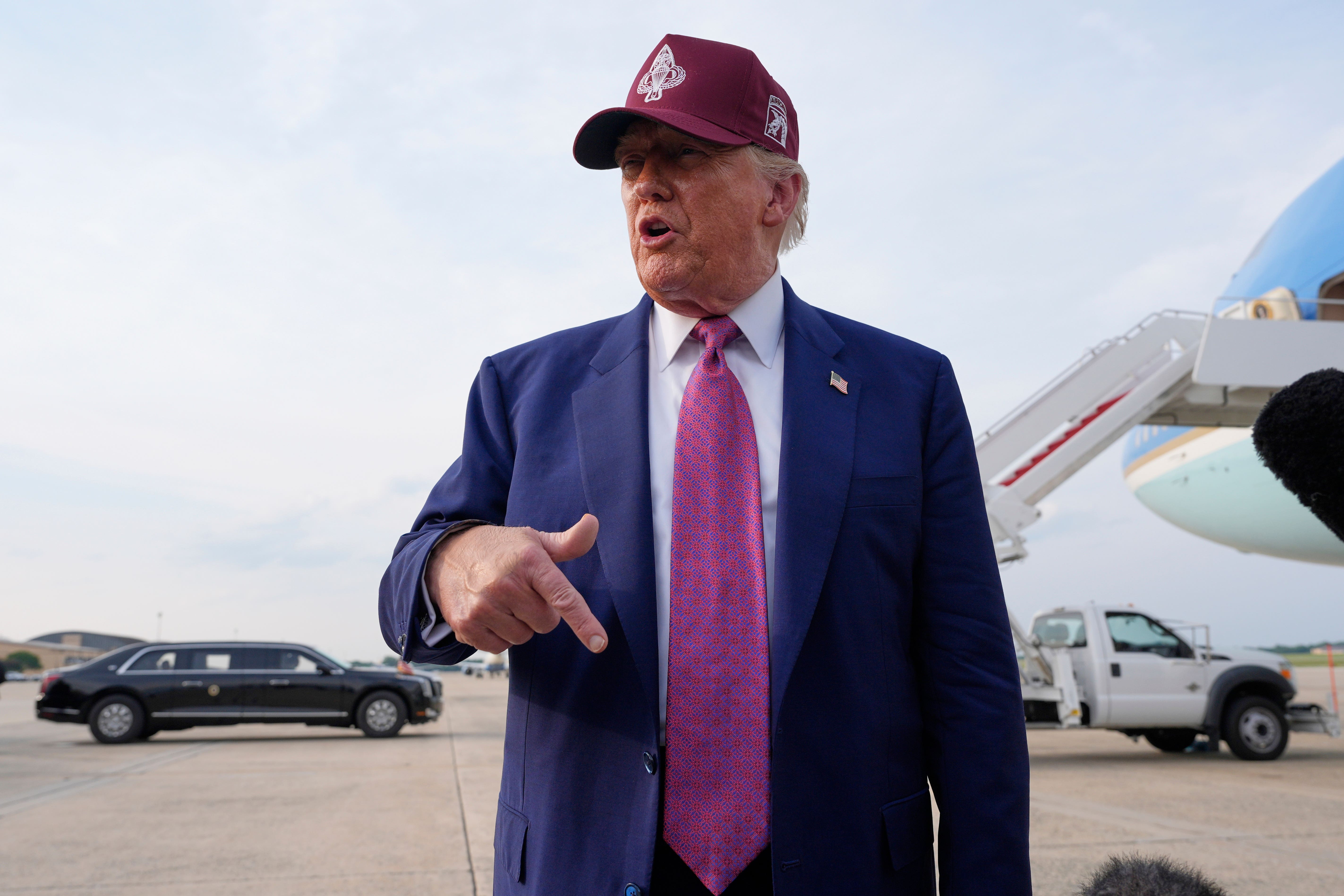 President Trump speaks to reporters after arriving on Air Force One