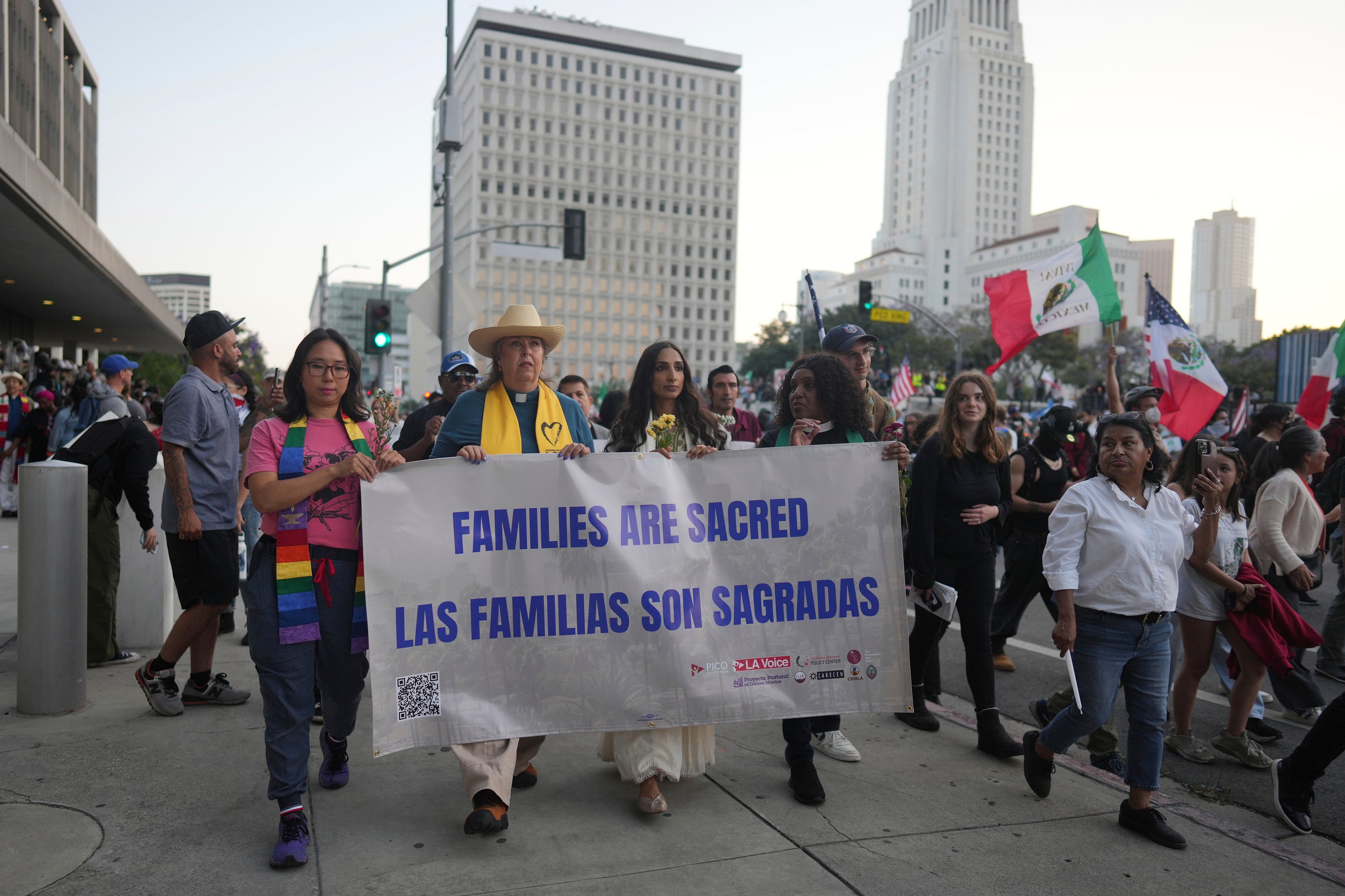 Demonstrators march during a protest in Los Angeles