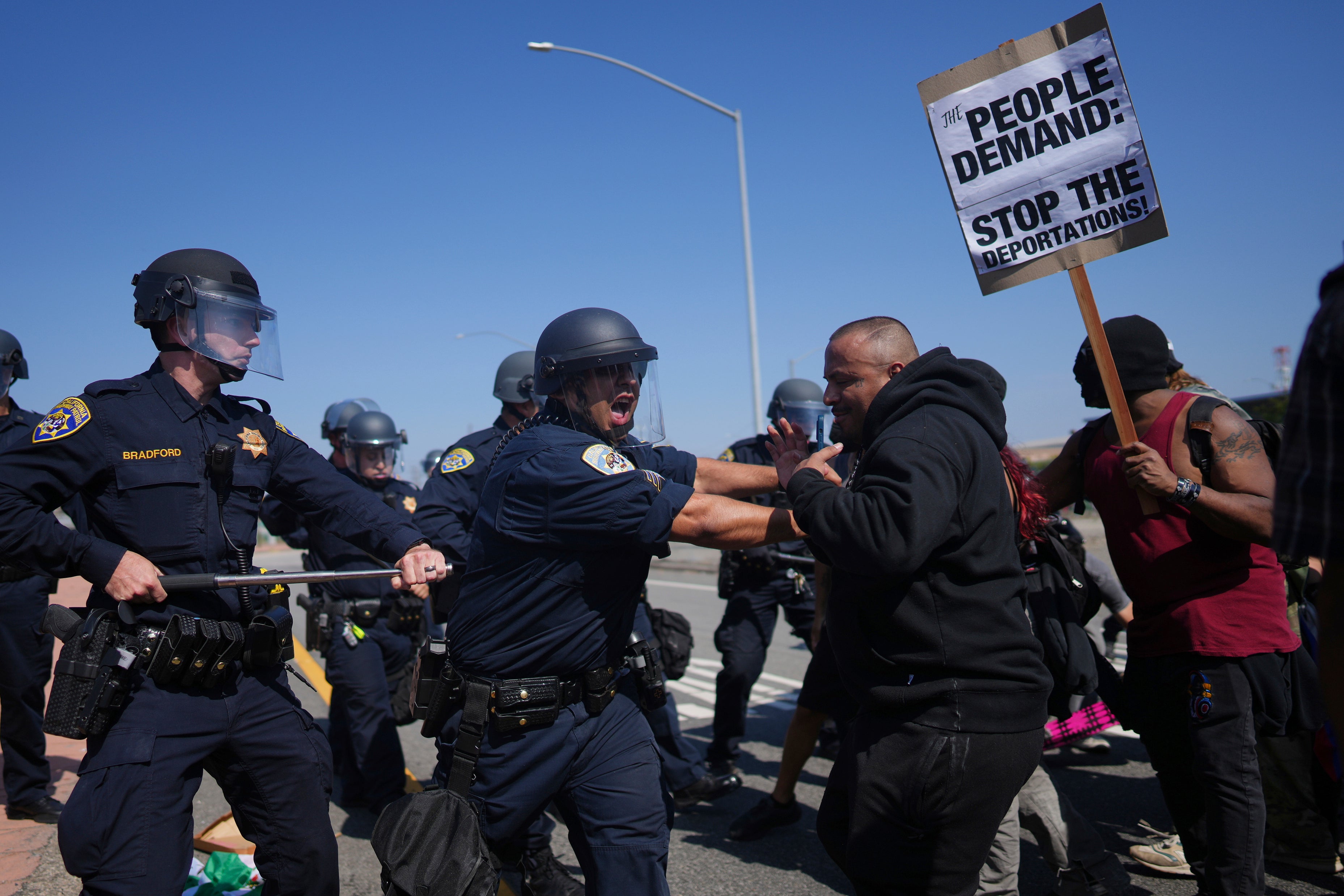 California Highway Patrol officers clash with protesters on Tuesday