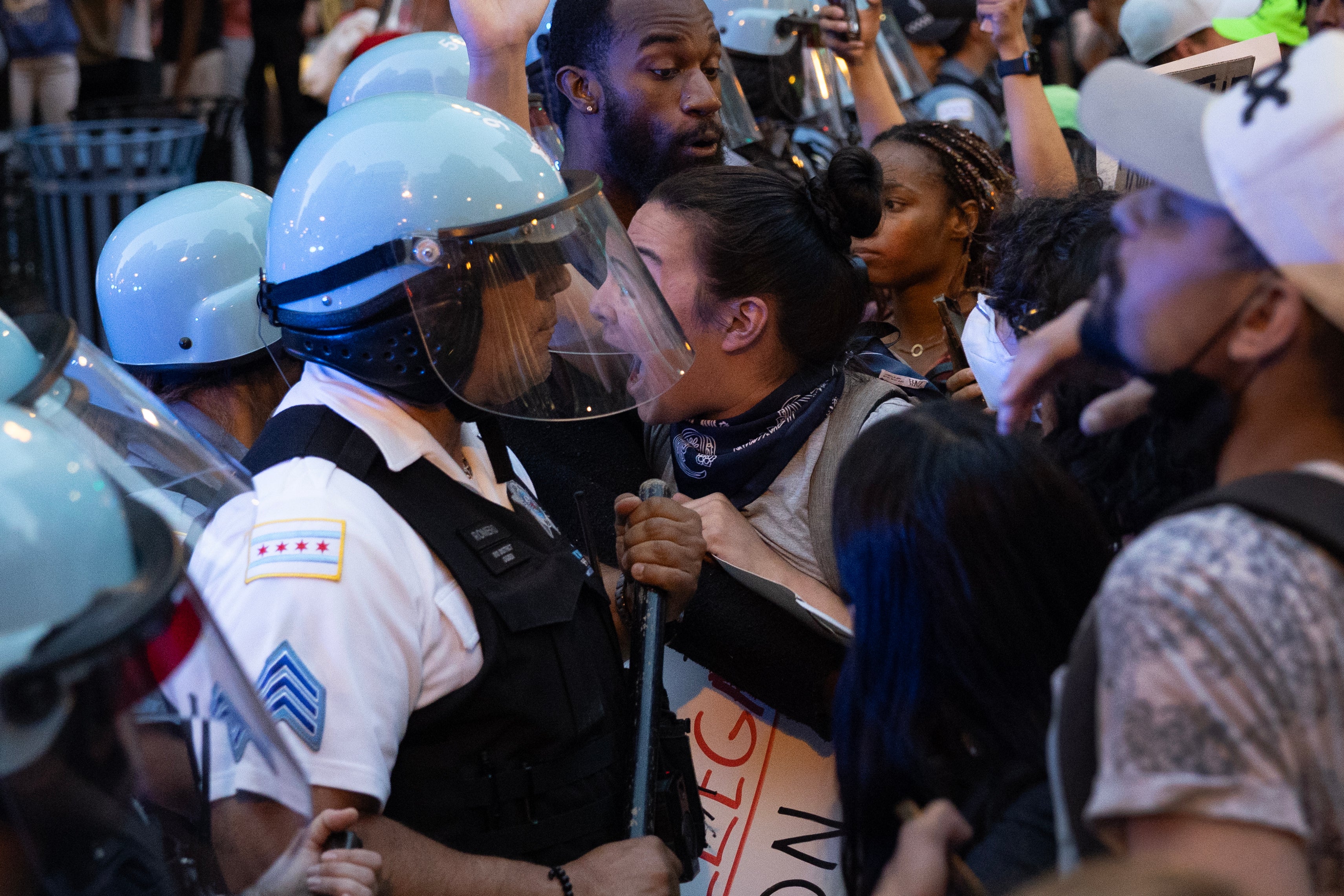 Police officers face off with protesters in the Loop on Tuesday in Chicago