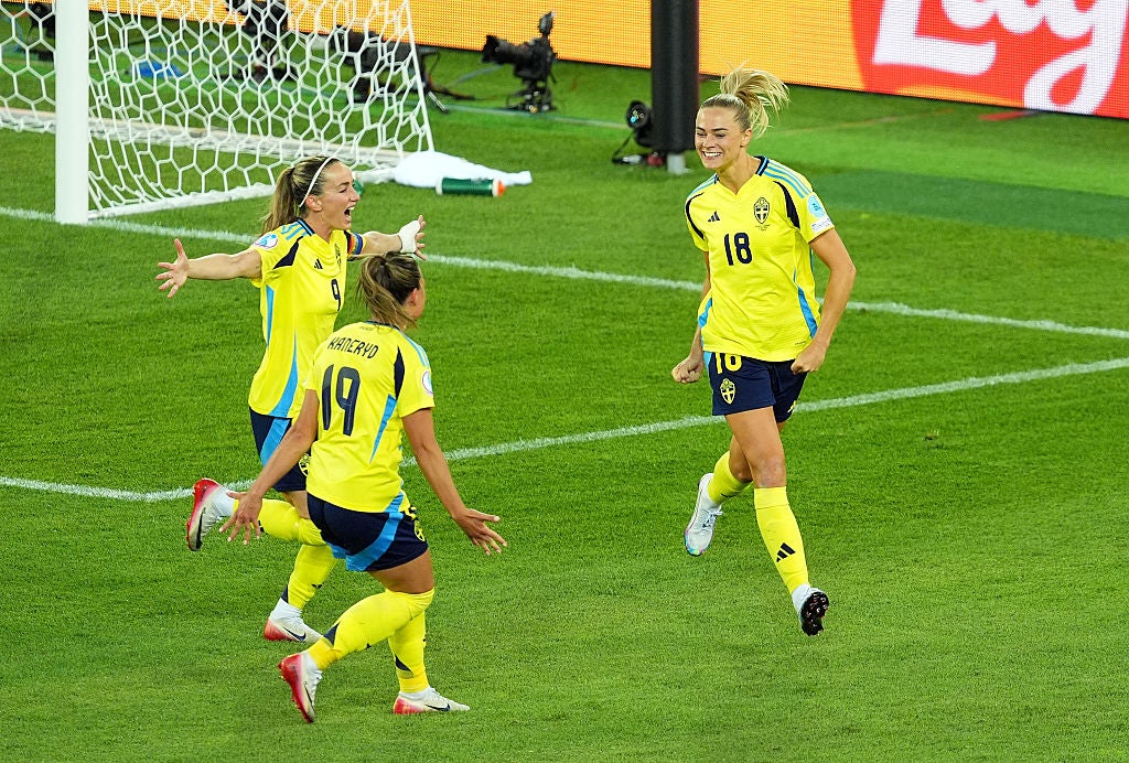 Sweden's Fridolina Rolfo, Kosovare Asllani and Johanna Rytting Kaneryd celebrate during the 4-1 win over Germany