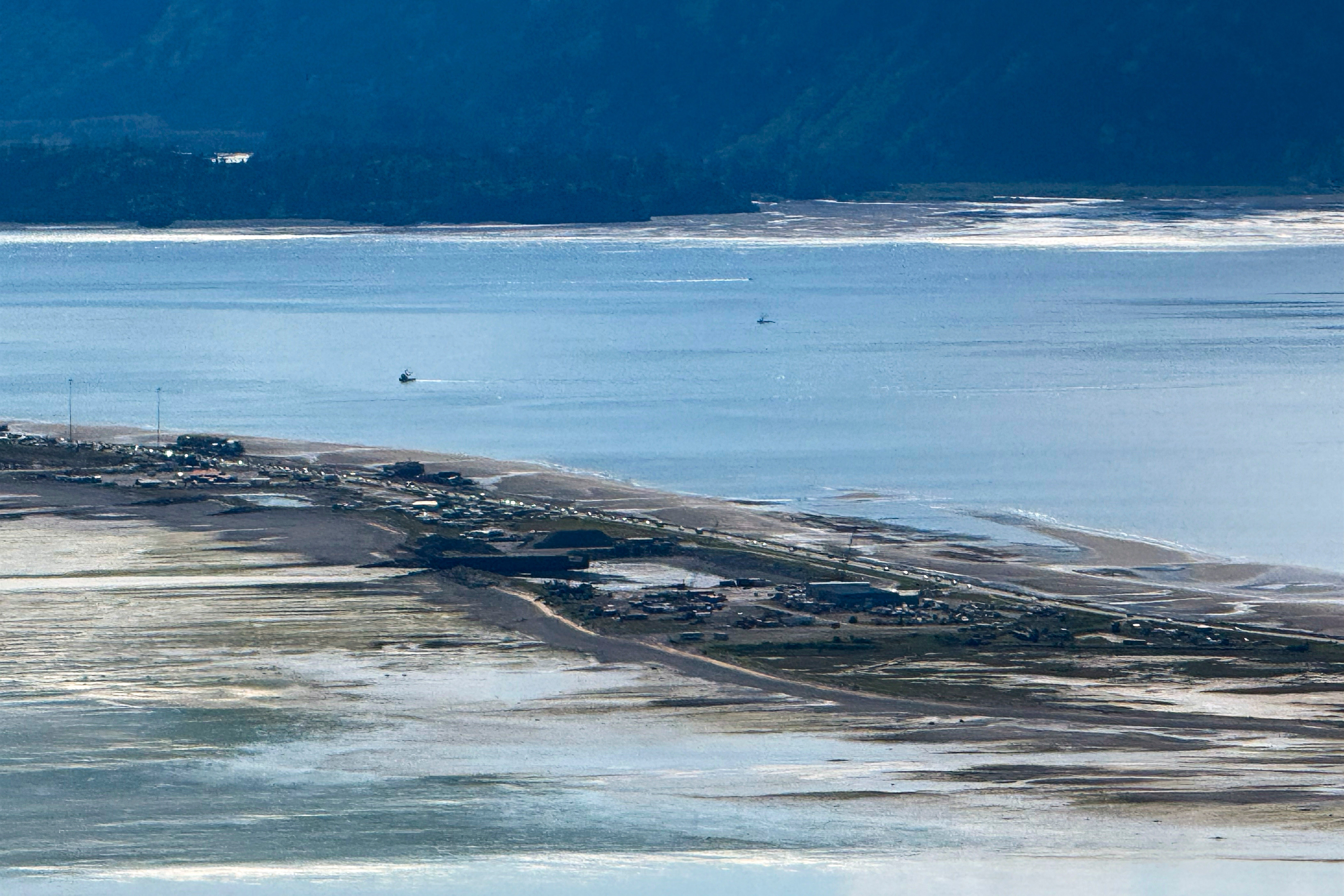 Cars leave Homer Spit in Alaska – where a tsunami struck and killed residents after an earthquake in 1964.