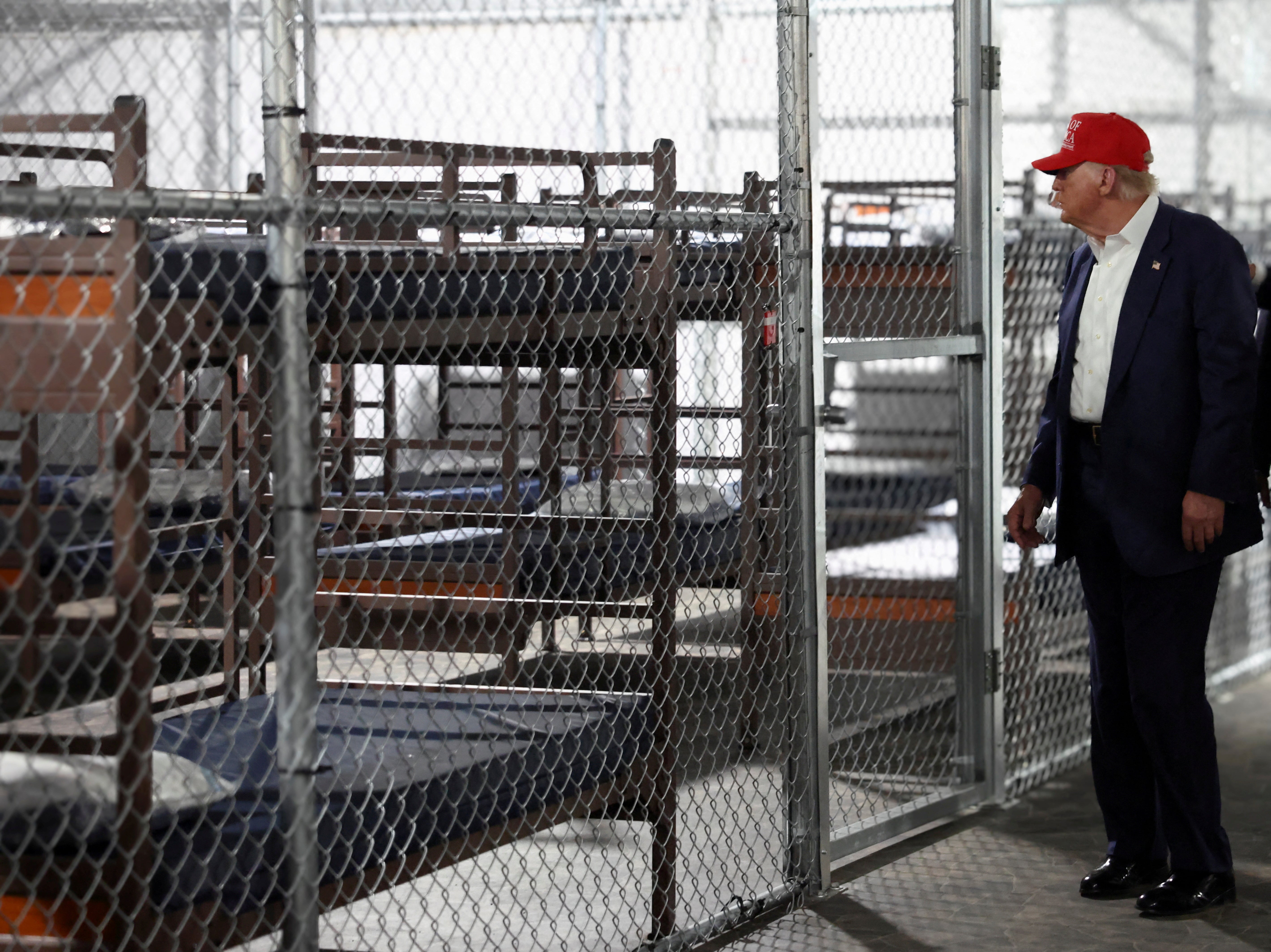 U.S. President Donald Trump visits a temporary migrant detention center informally known as