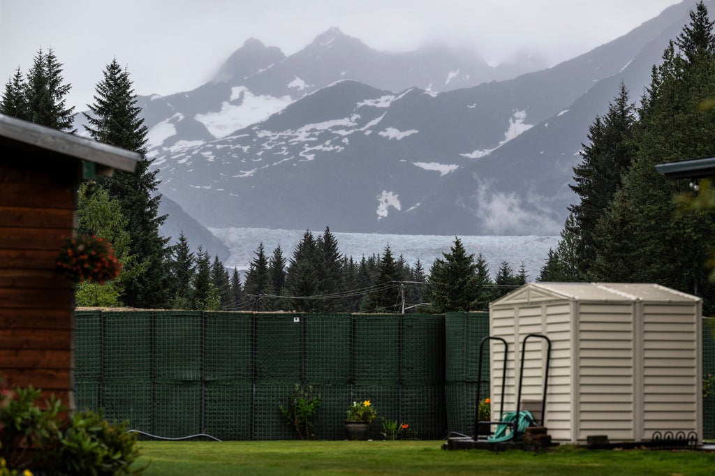 The Mendenhall Glacier is visible in the distance from a residential area of Juneau