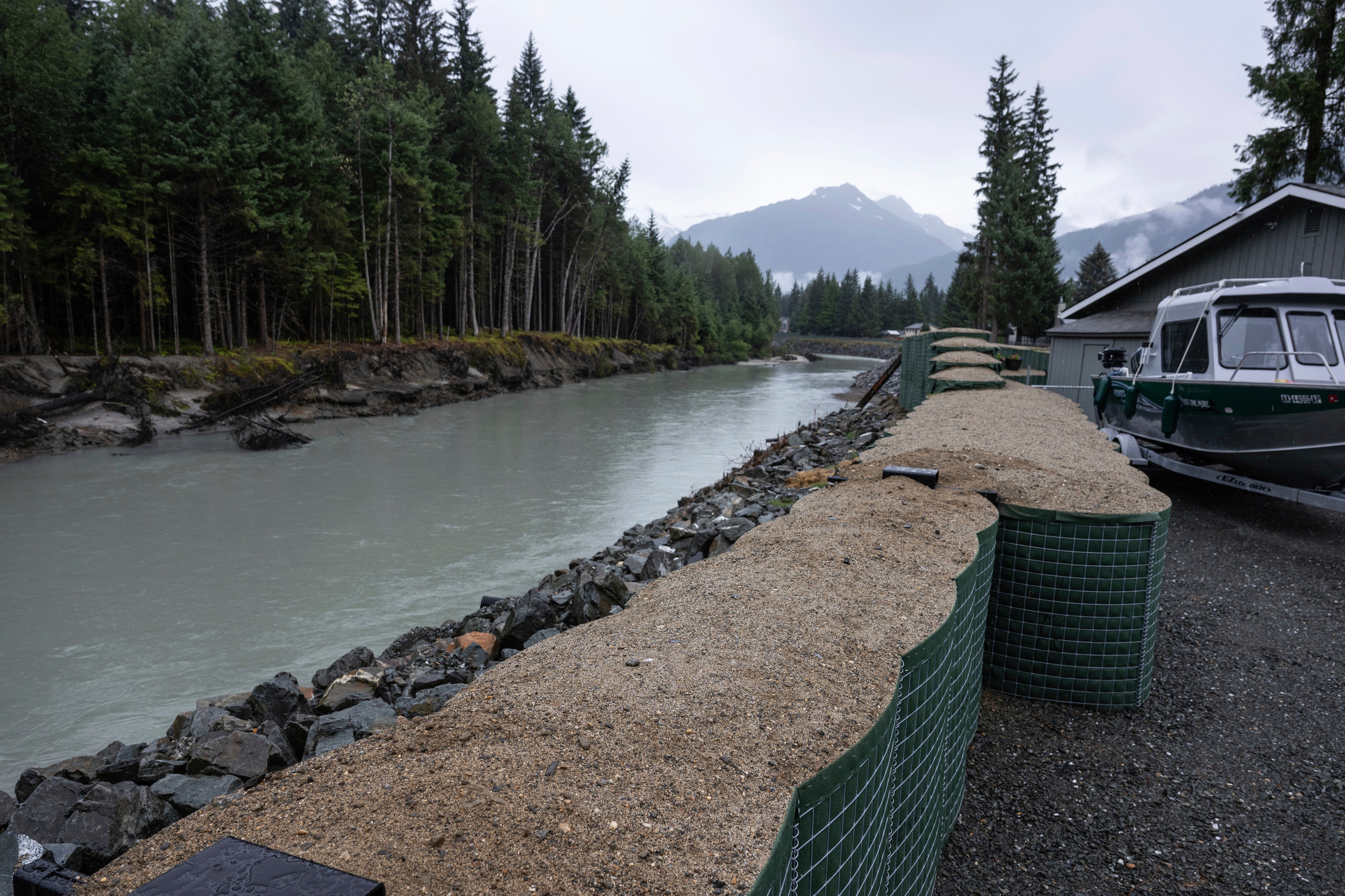 HESCO flood barriers, to protect properties against glacial outburst flooding, separate a residential area from the Mendenhall River