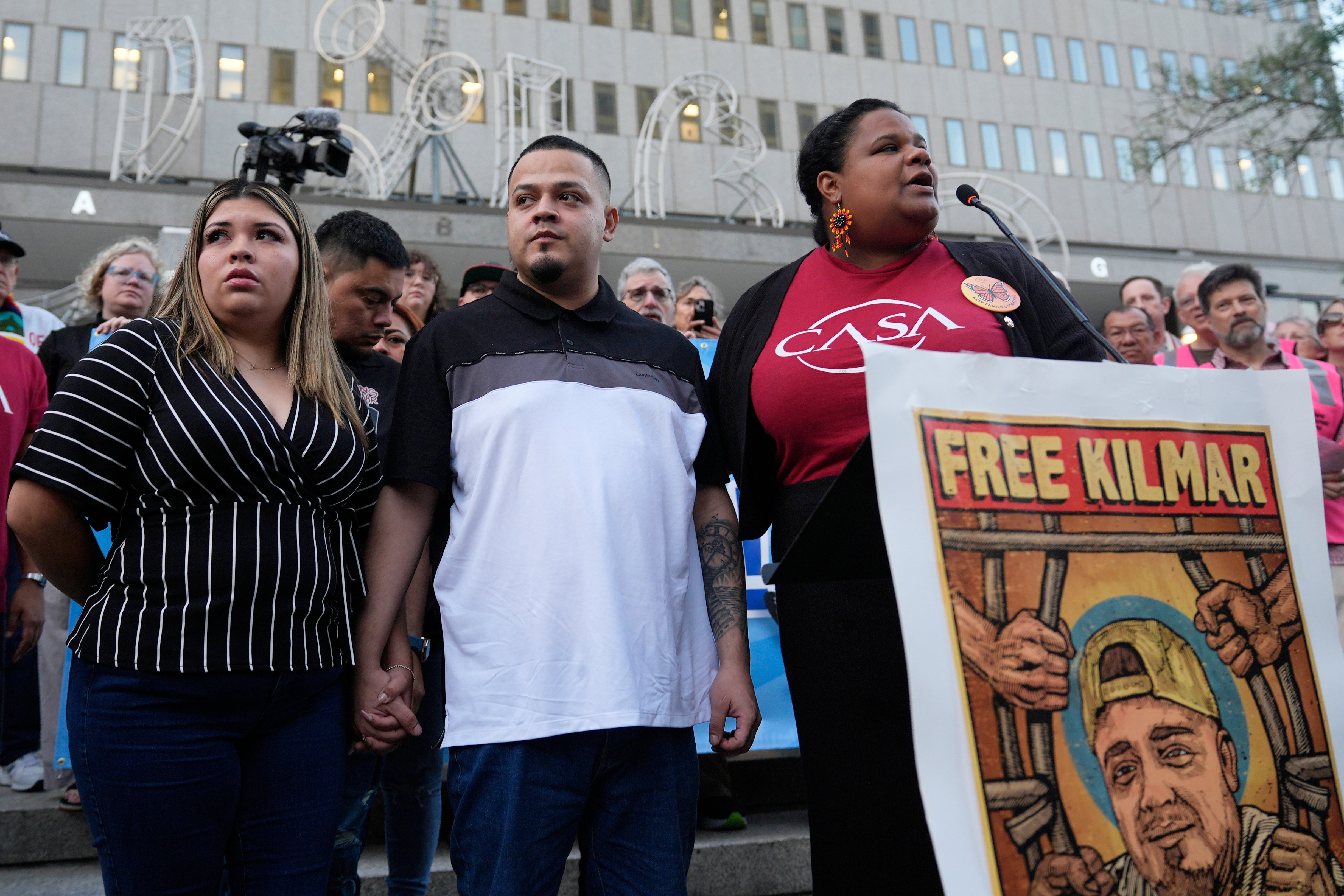 Kilmar Abrego Garcia, center, is suing the Trump administration yet again to stop the government’s attempt to deport him from the country, this time to Uganda. A federal judge overseeing the case has temporarily blocked his removal