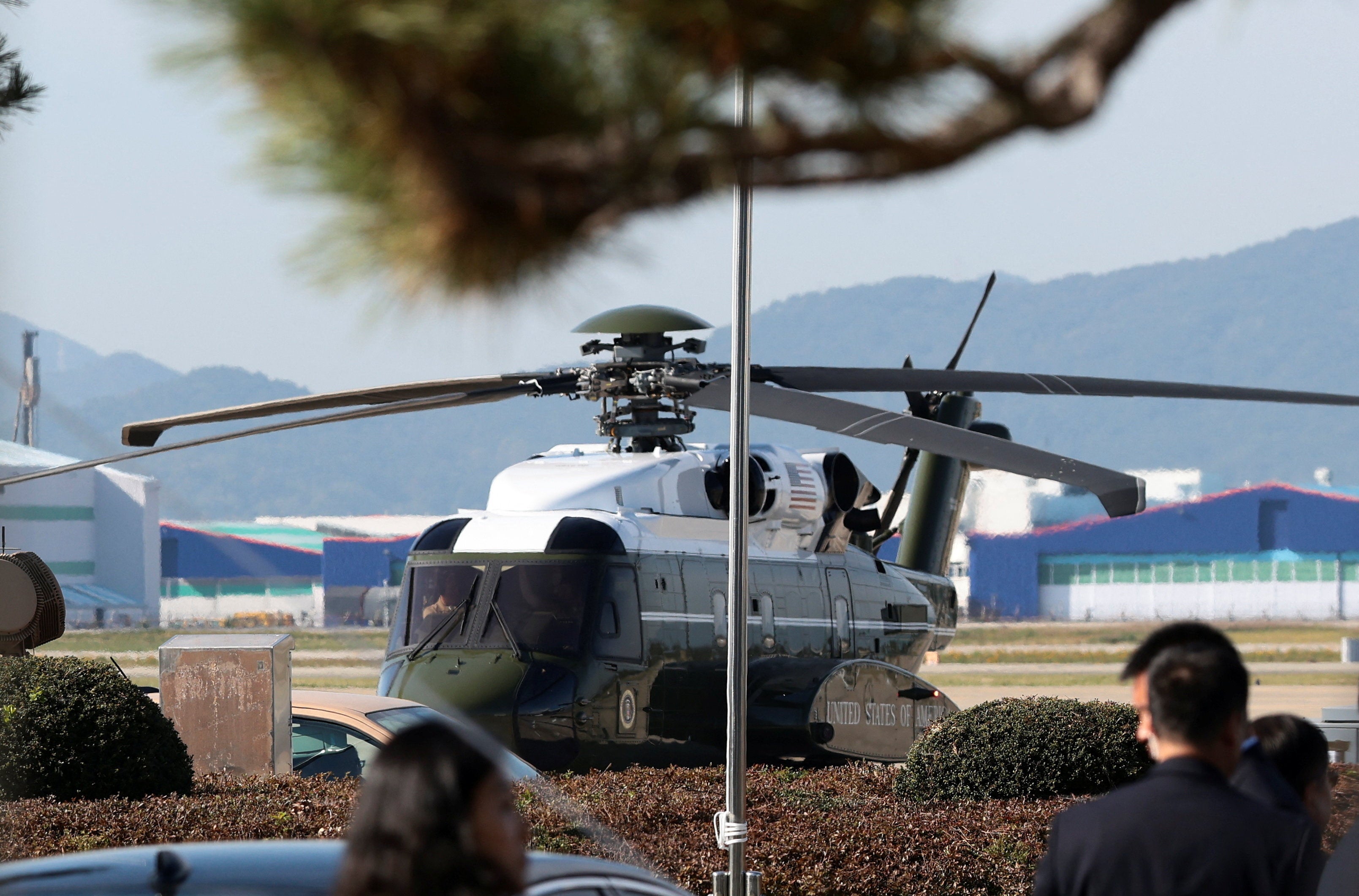 Marine One, carrying President Donald Trump, arrives at Gimhae International Airport