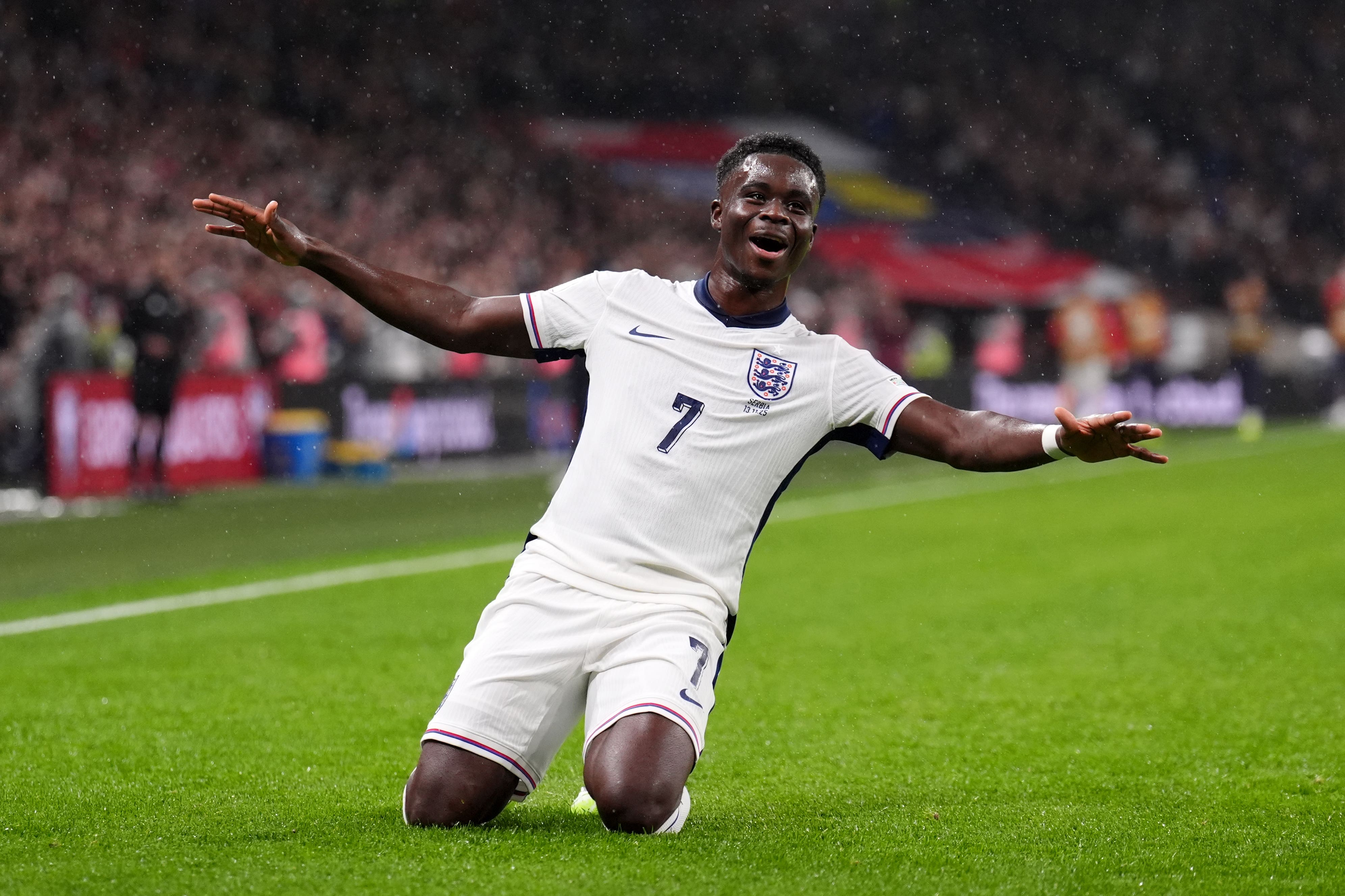 Saka celebrates after his shot hits the net (John Walton/PA)
