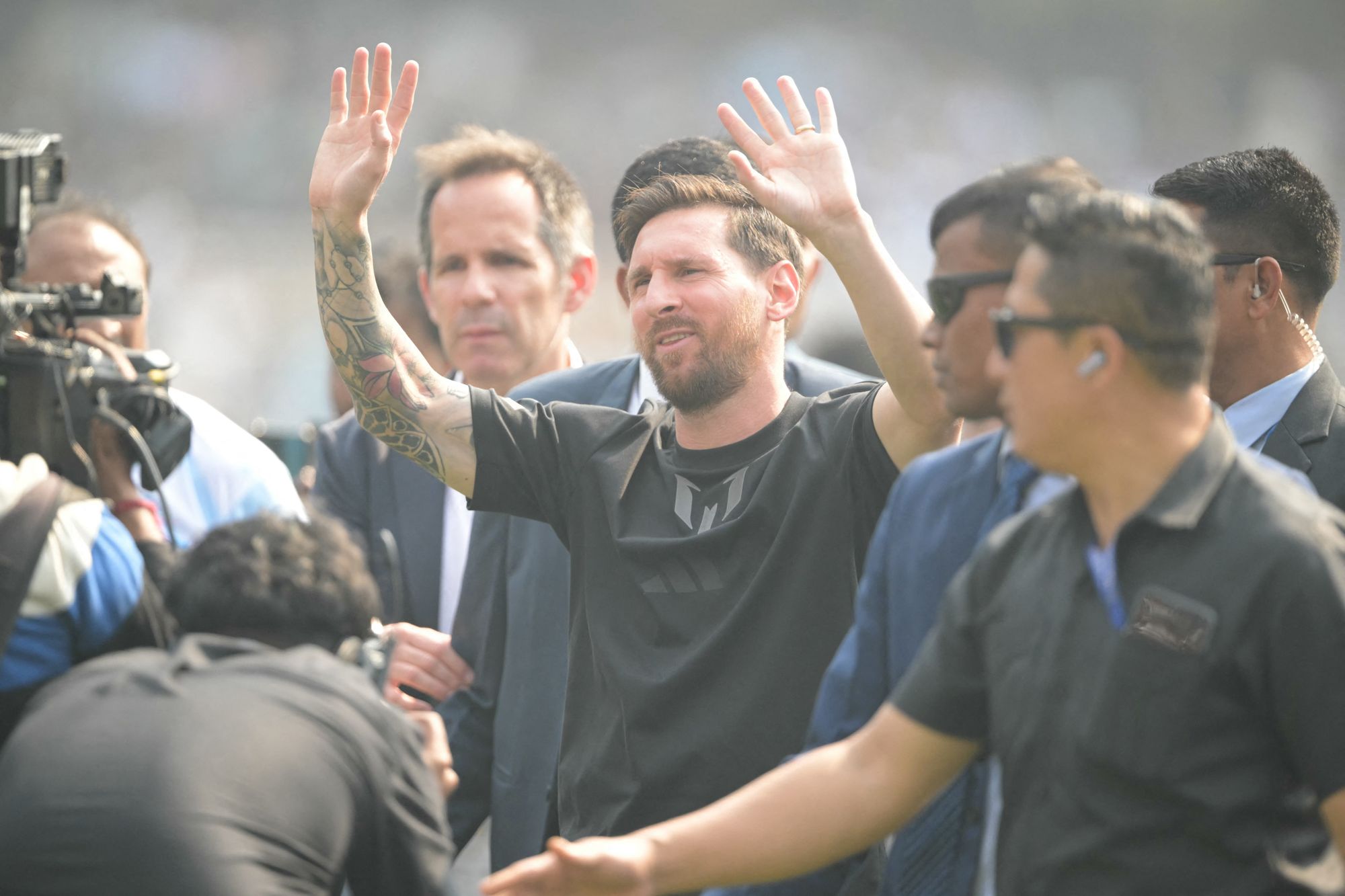Messi was surrounded by a delegation on his brief visit to the stadium