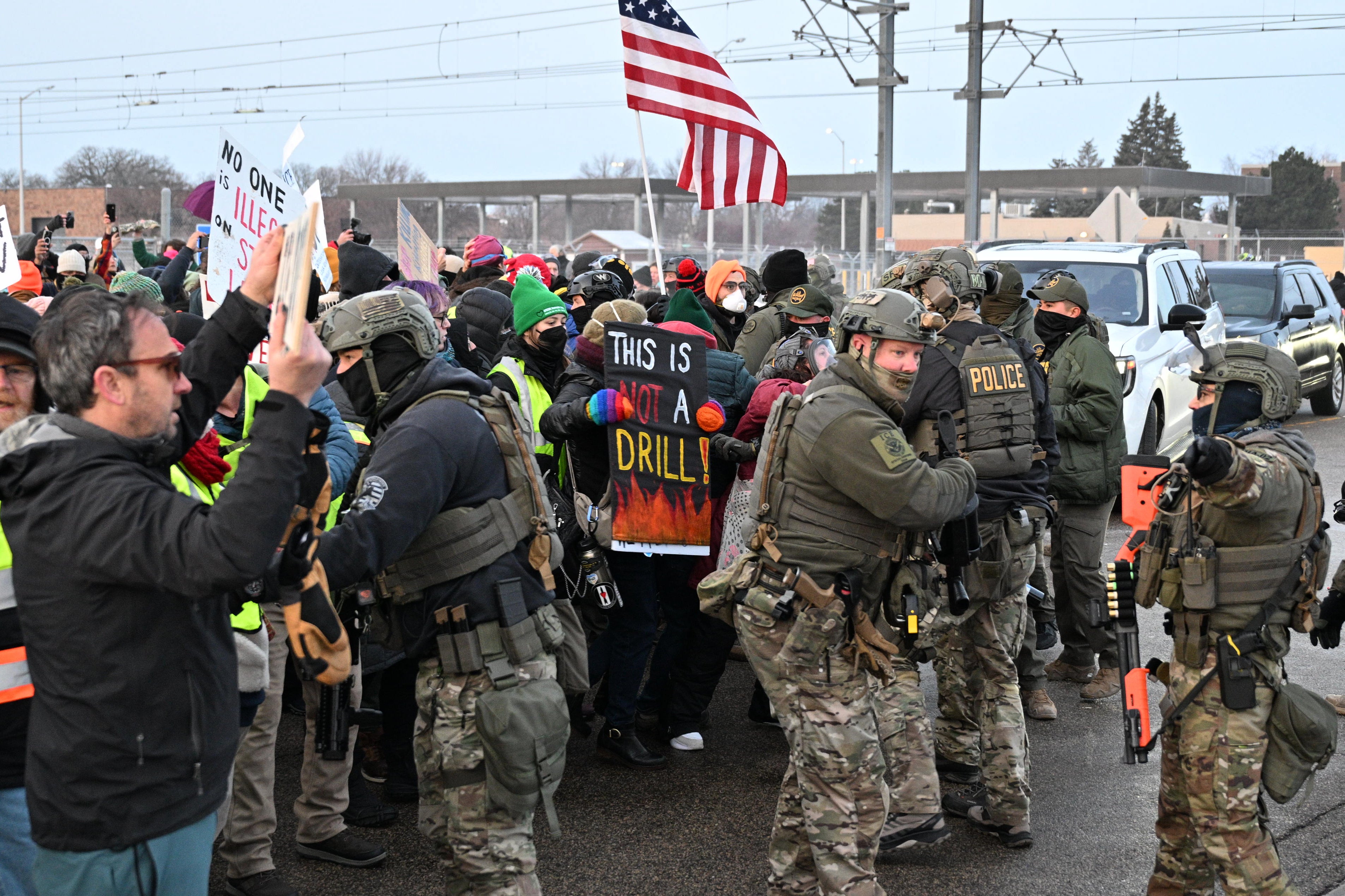 Protesters clash with federal agents outside the Bishop Henry Whipple Federal Building in Minneapolis