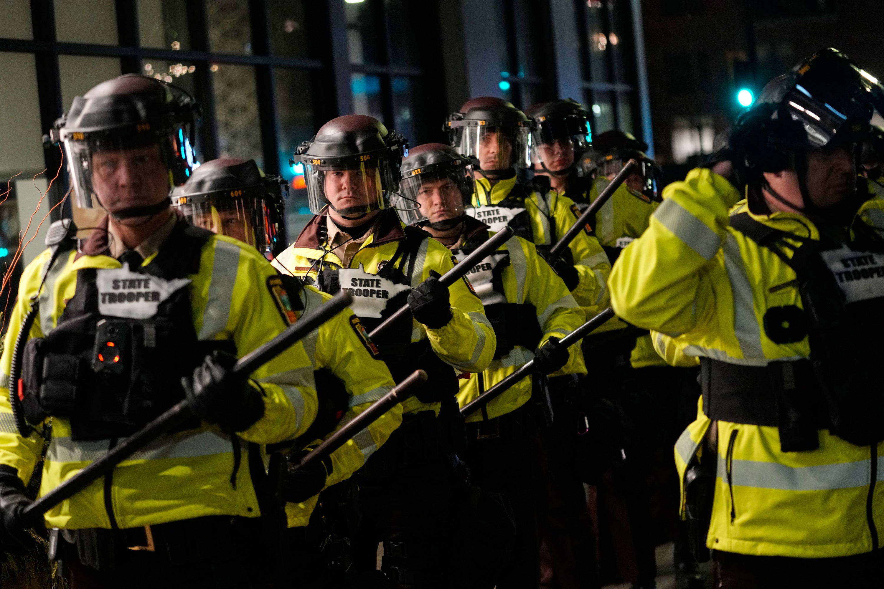 Minnesota State Patrol officers are seen during a protest calling for an end to federal immigration enforcement operations in the city