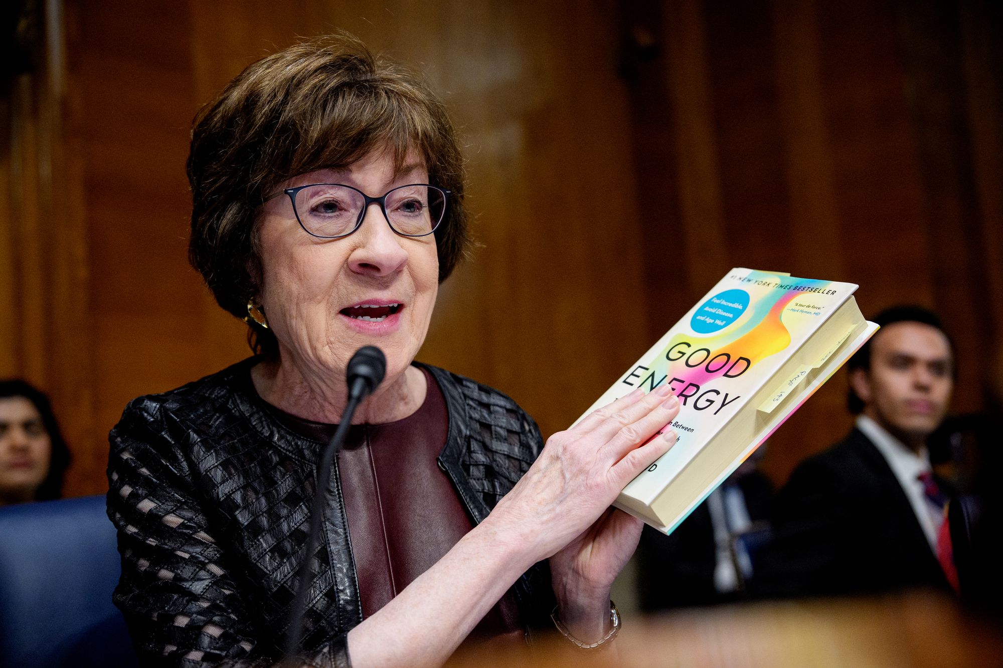 Sen. Susan Collins holds up Dr. Casey Means' book 'Good Energy' during her nomination hearing