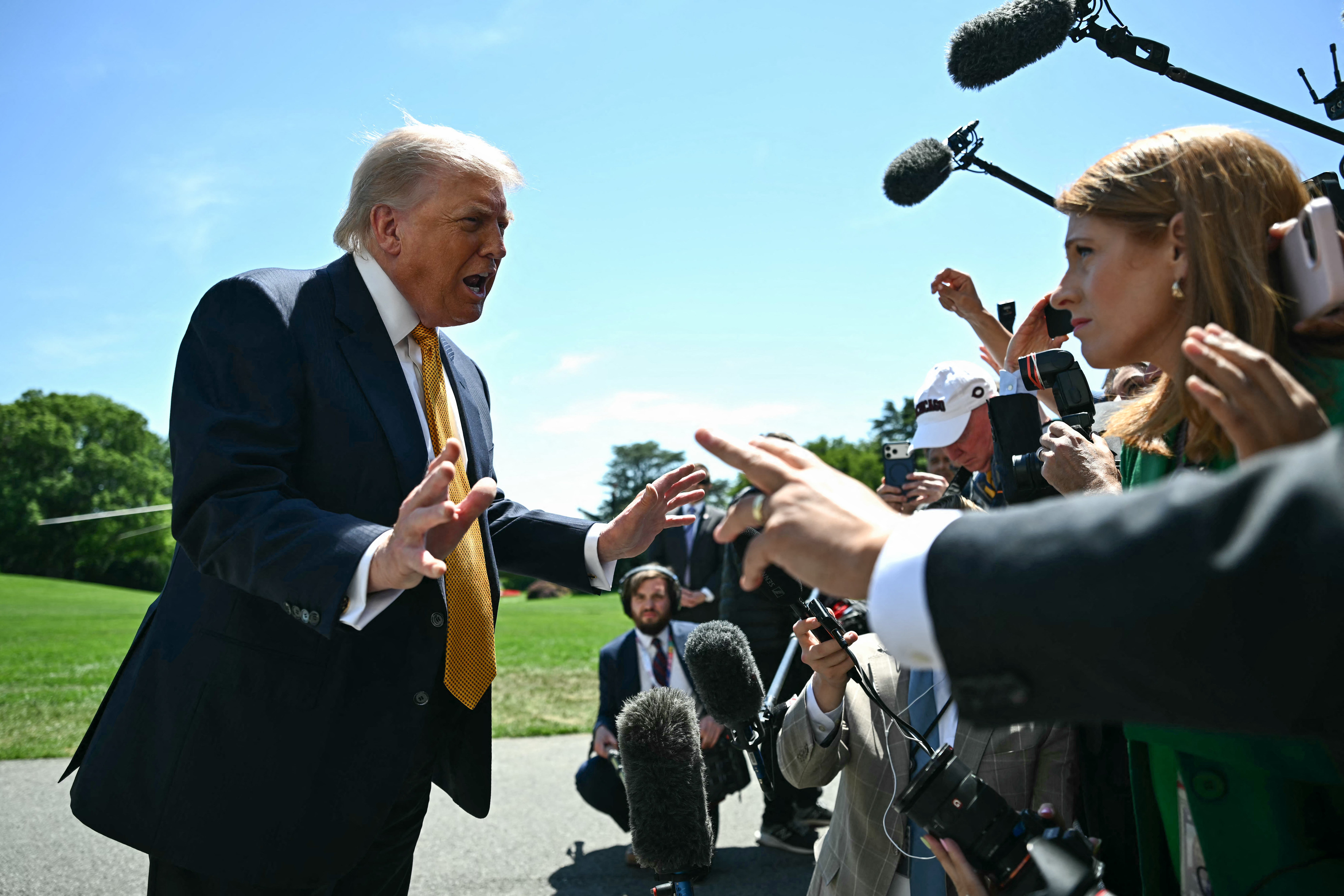 Trump speaks to reporters outside the White House in Washington and said, ‘I don't think about Americans' financial situation’
