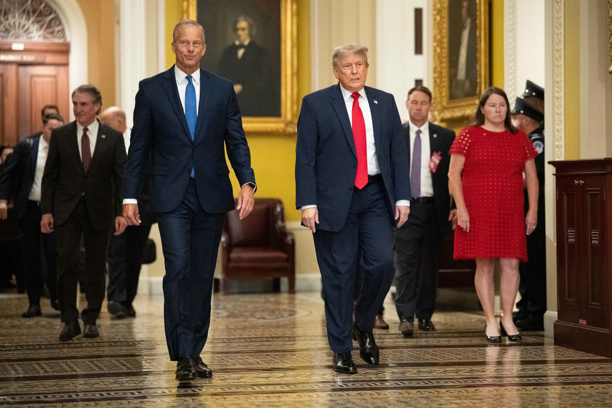 President Donald Trump walks with Senate Majority Leader John Thune, (R-SD), on the way to a lunch meeting with Senate Republicans at the US Capitol in Washington, DC, on June 24, 2026