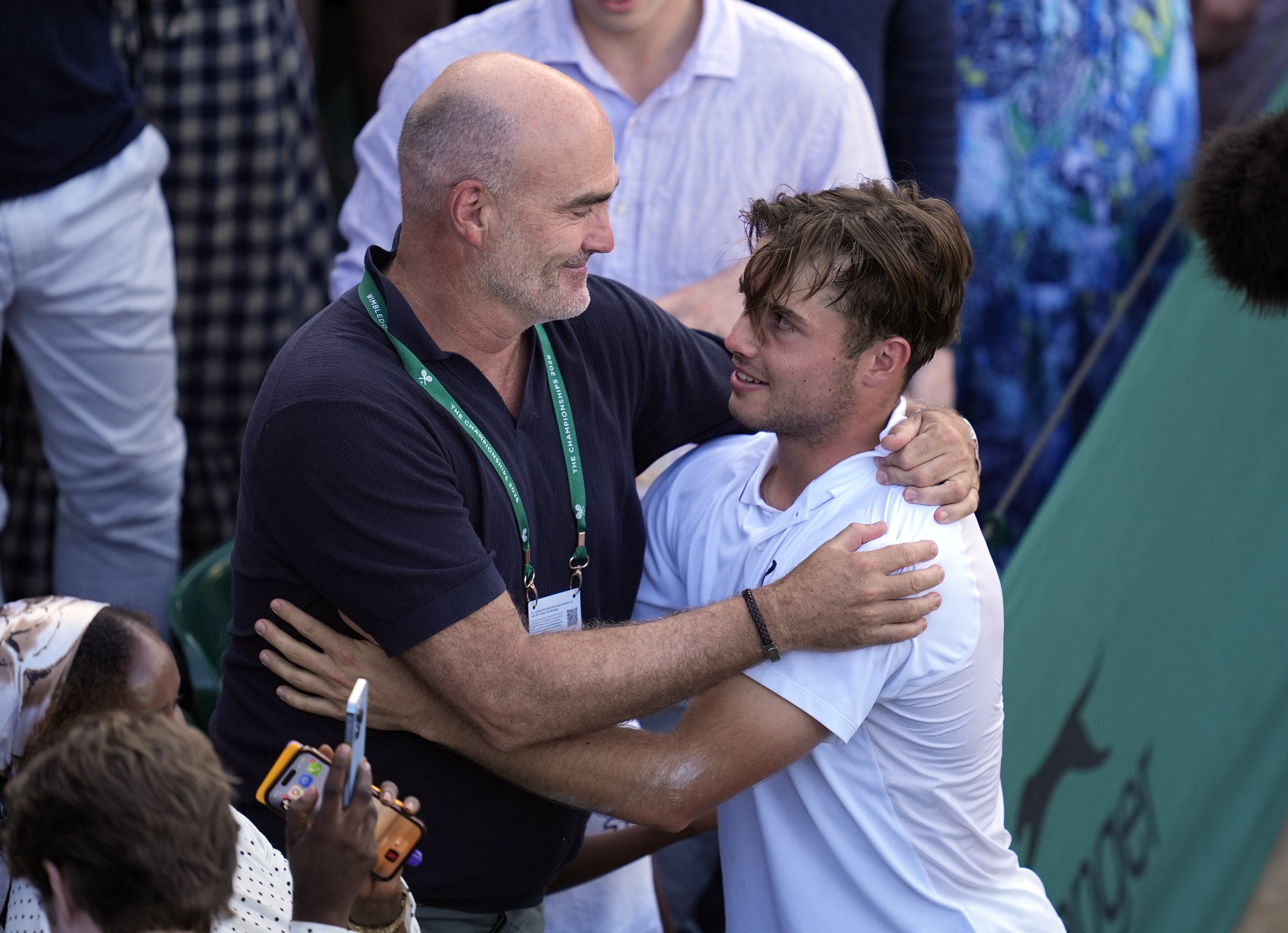 Arthur Fery, right, embraces father Loic (Andrew Matthews/PA)