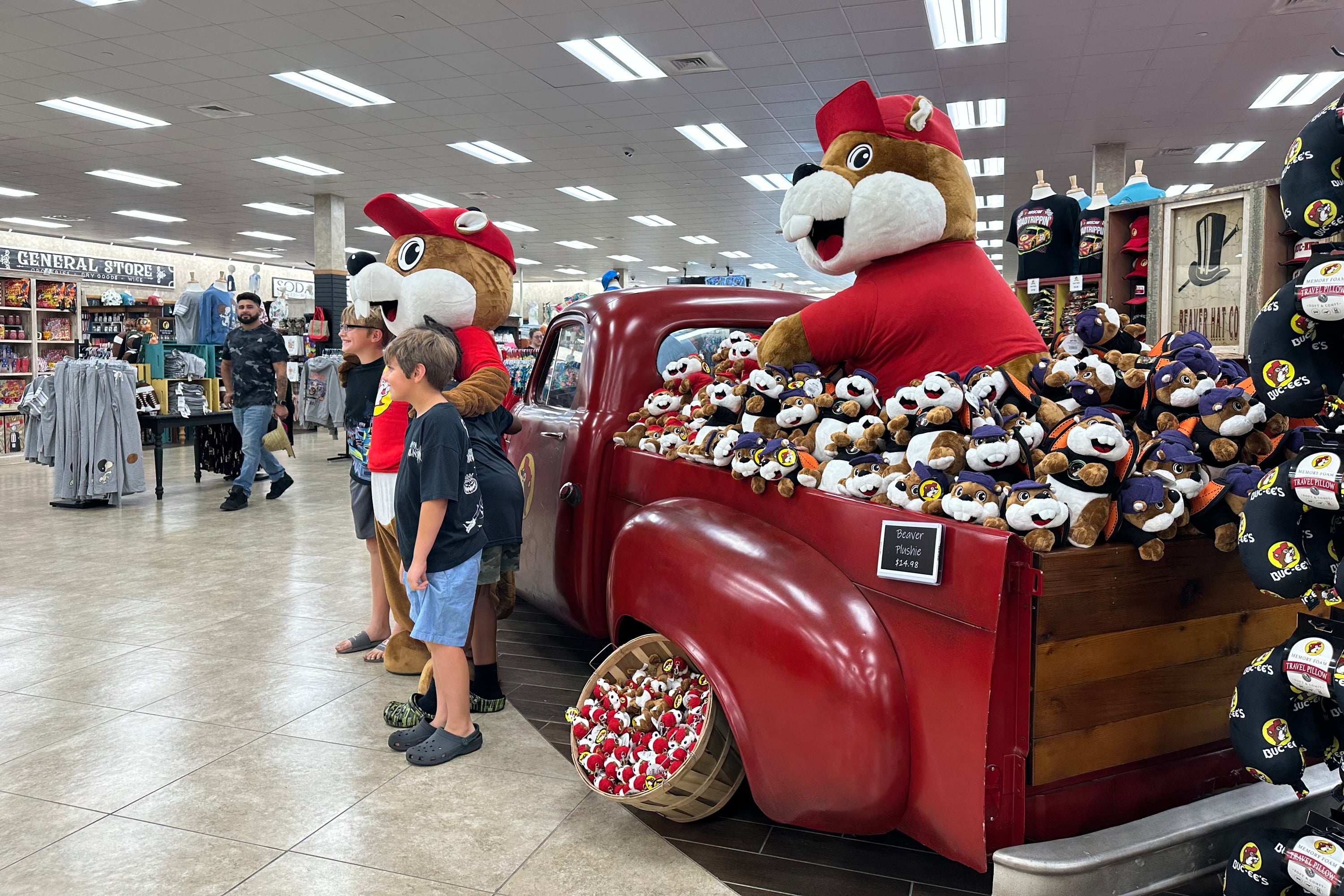 Customers at the Buc-ee's location in Huber Heights, Ohio, pose with the company's mascot