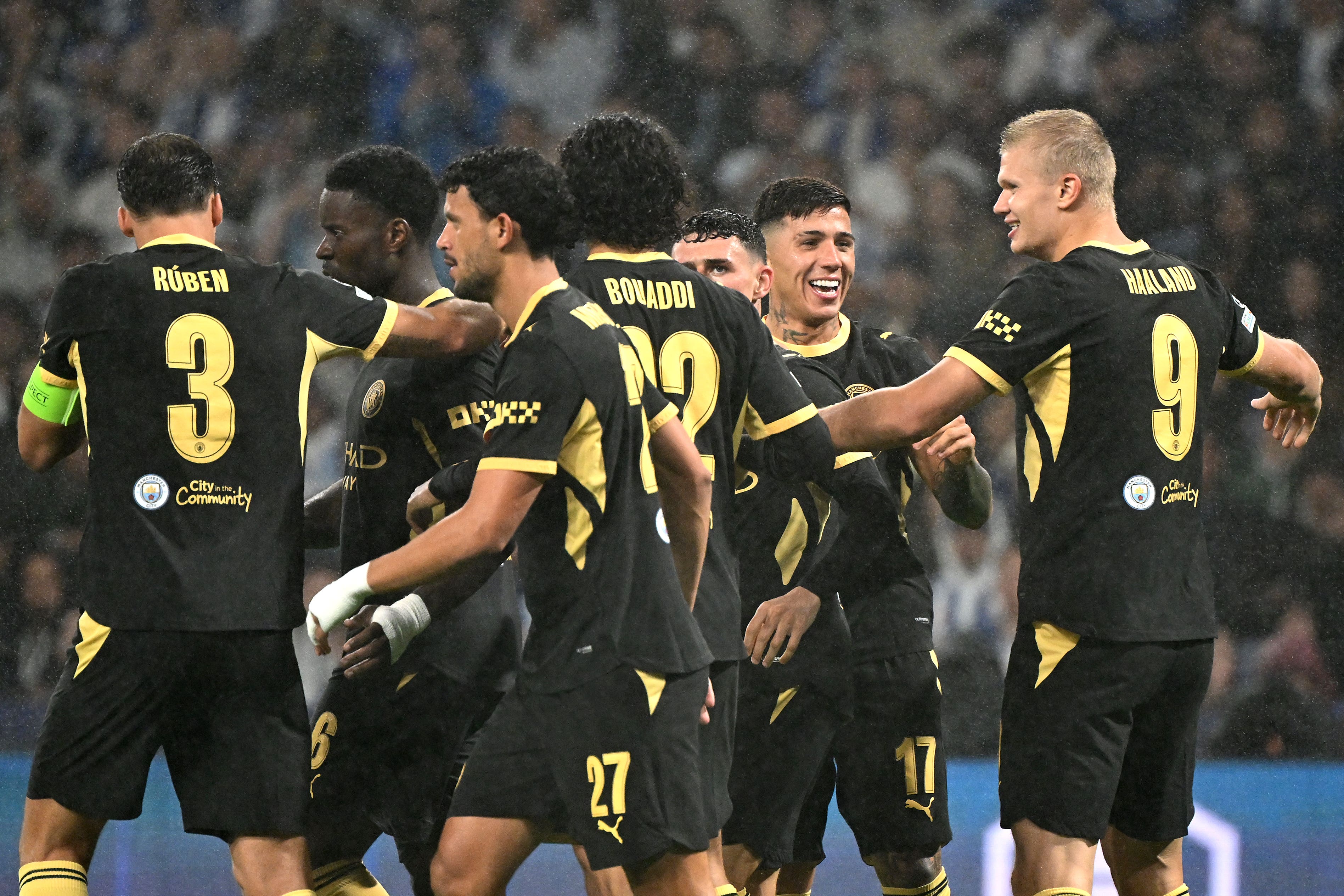 Erling Haaland, right, celebrates his first goal with Manchester City teammates