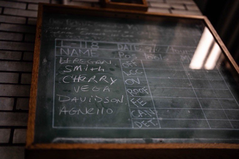 A chalkboard that has been preserved for the past 25 years in Brooklyn’s Middagh Street firehouse lists the assignments of the Ladder 118 crew members killed on 9/11