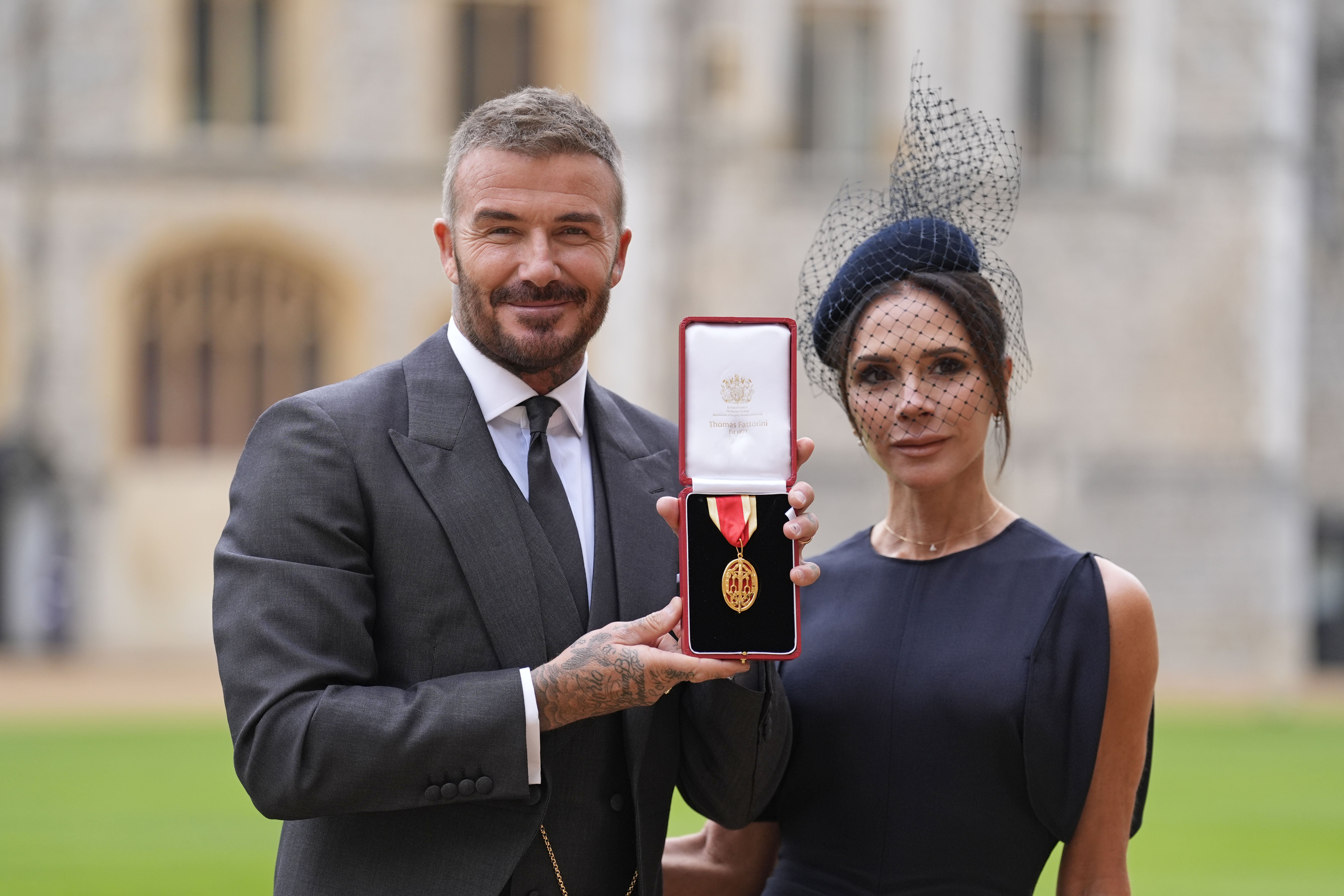 Sir David Beckham, with his wife Lady Beckham, after he was made a Knight Bachelor in 2025 (Andrew Matthews/PA)