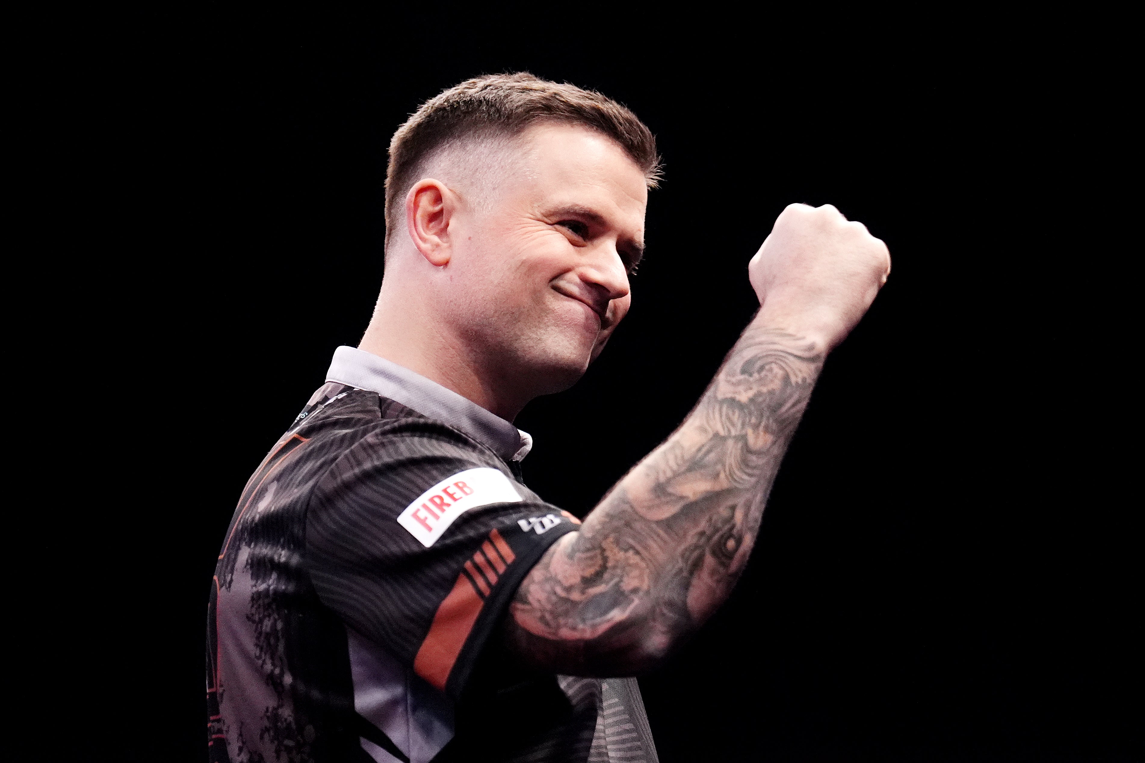 Luke Woodhouse produceed the biggest win of his career by defeating Luke Littler (John Walton/PA)