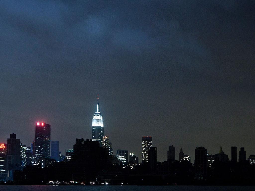 Much of the New York City skyline sits in darkness after Hurricane Sandy