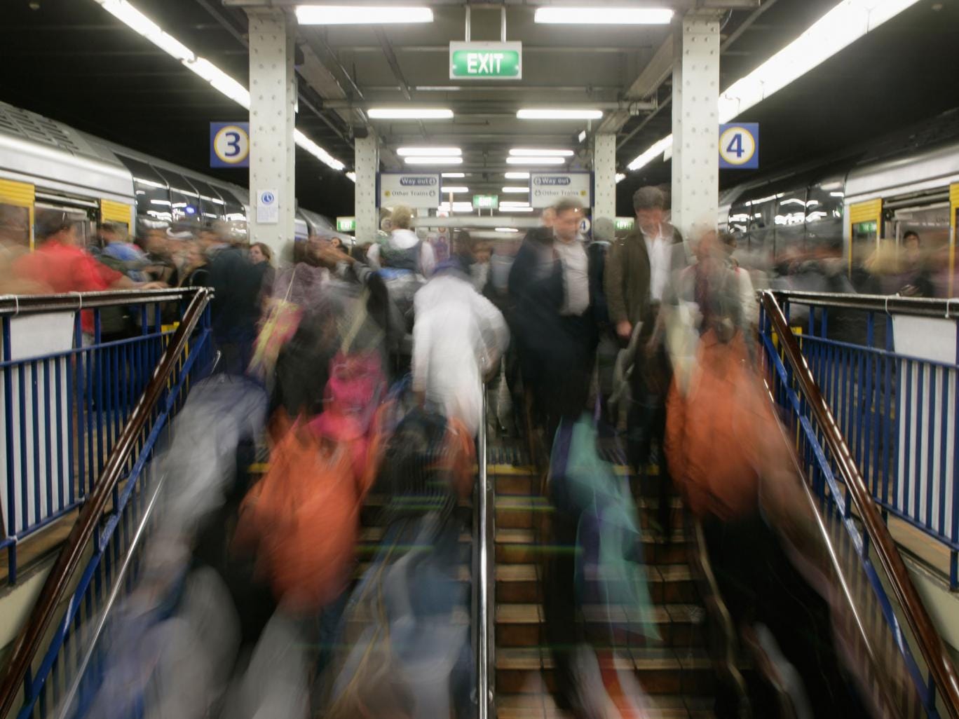 Commuters get on and off the train at Wynyard Station in the Sydney, not related to the incident in which a train of 100 people was evacuated after a man reportedly told staff he had AIDs
