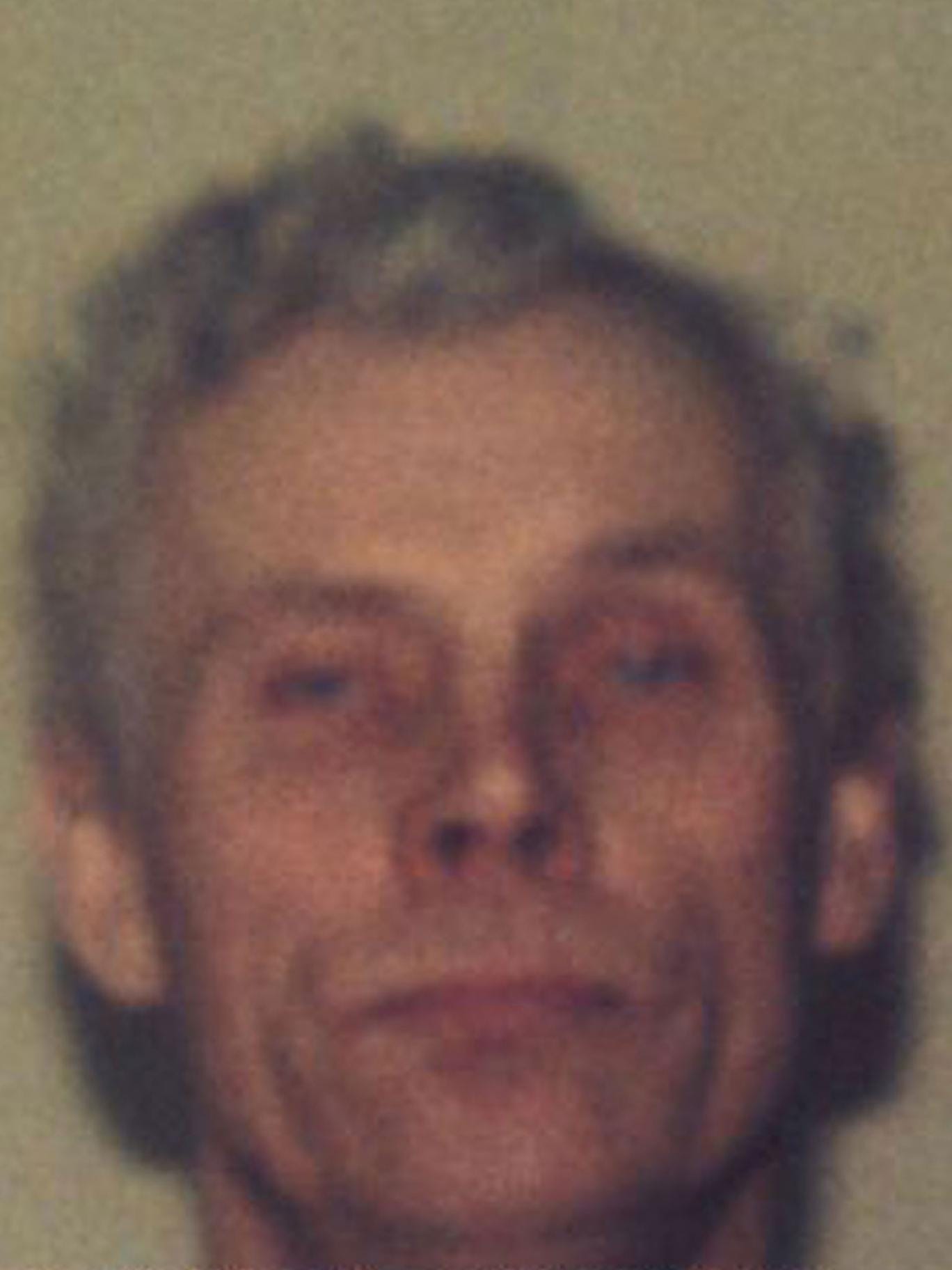 A photo Houchin released by police after he fled prison in 1993 - v2-Alan-Houchin