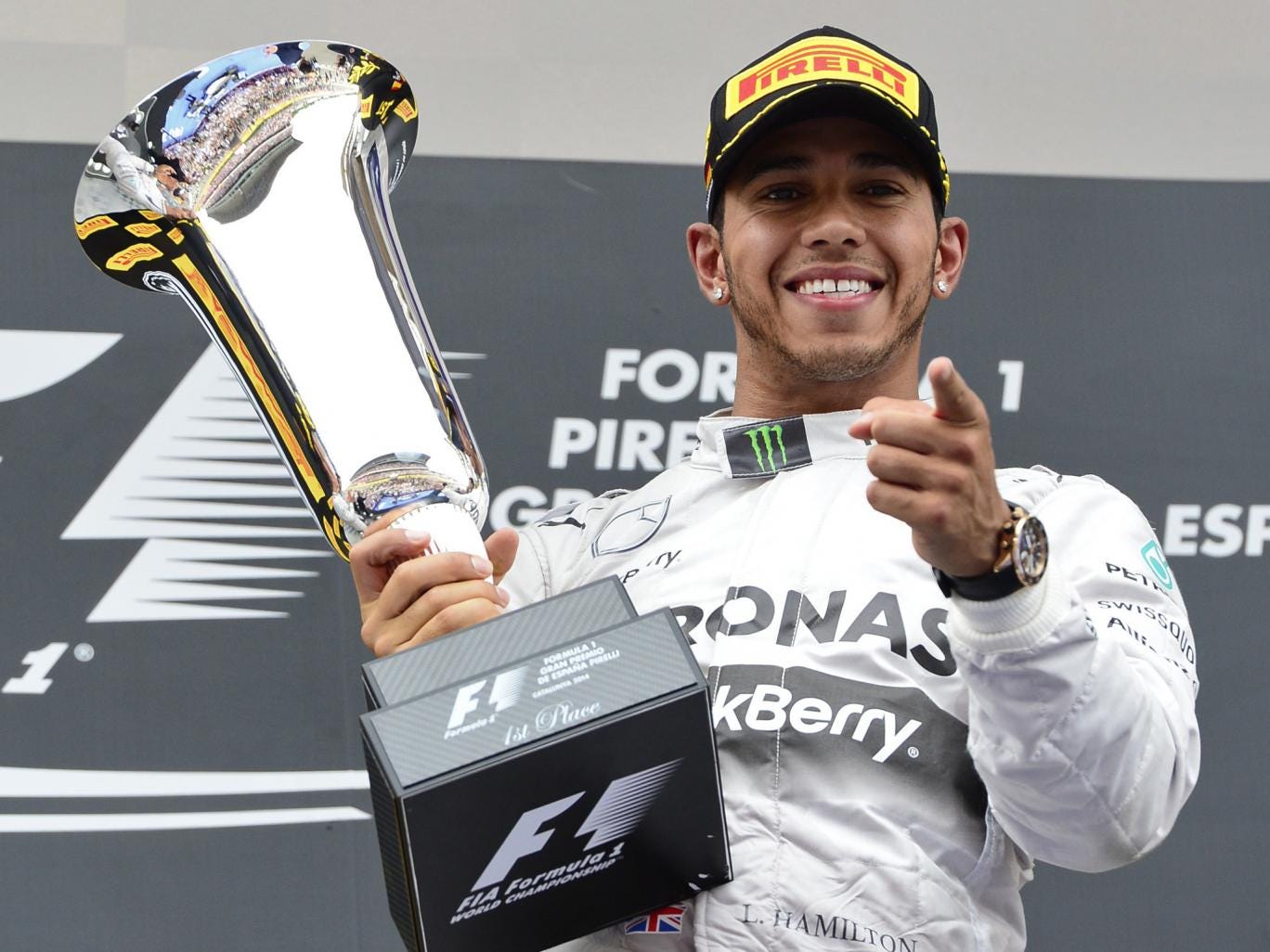 Lewis Hamilton celebrates with his trophy after winning the Spanish Grand Prix