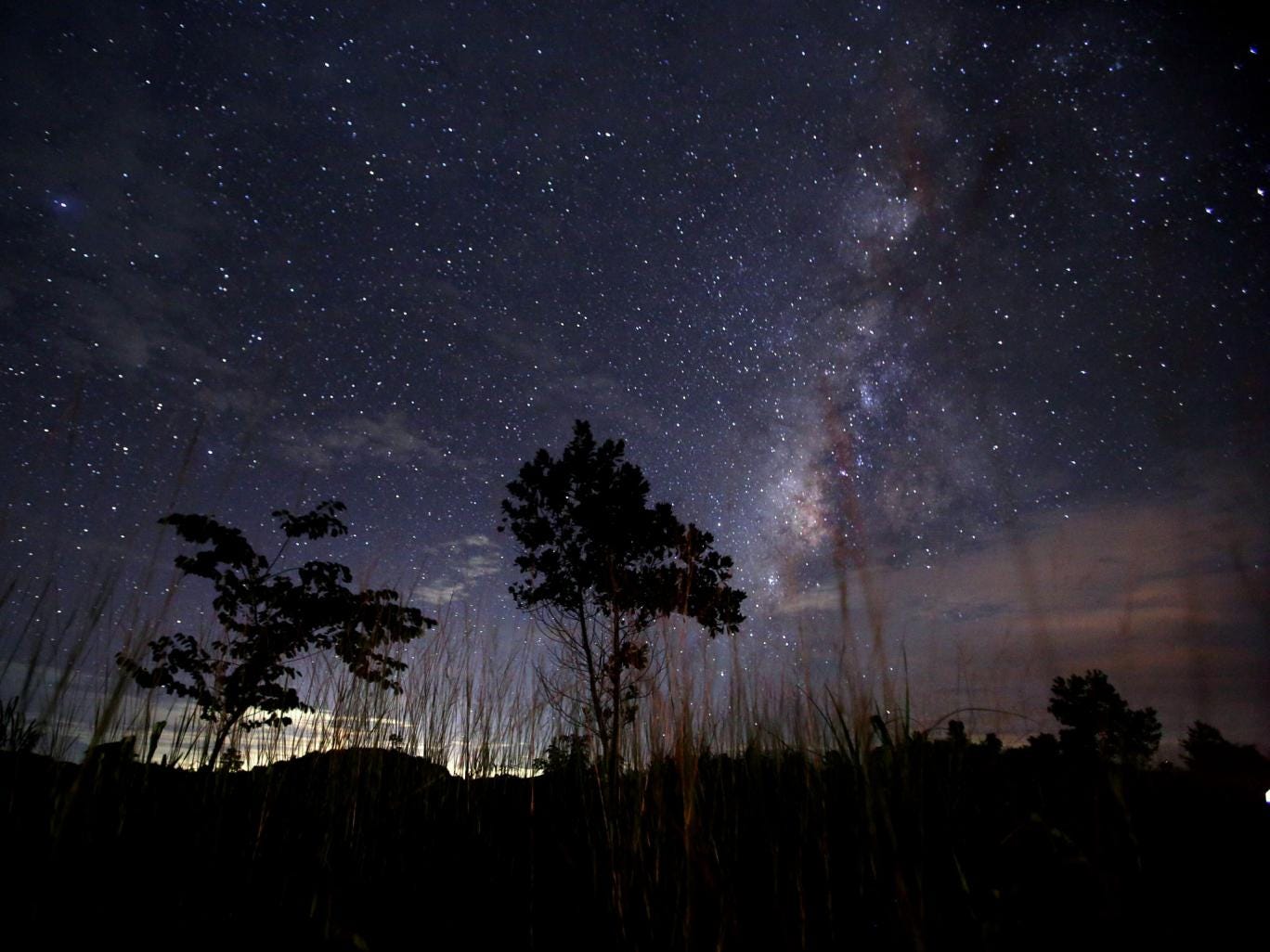 This long-exposure photograph taken on August 12, 2013 shows the Milky Way in the clear night sky near Yangon. The Perseid meteor shower occurs every year in August when the Earth passes through the debris and dust of the Swift-Tuttle comet.