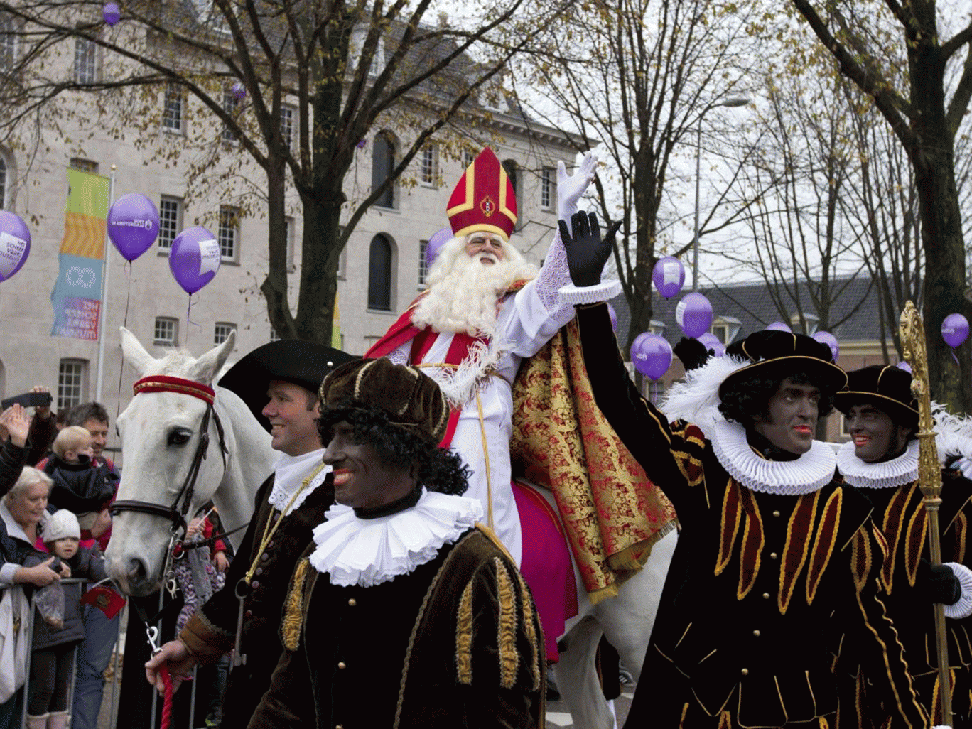 Sinterklaas, the Dutch version of Santa Claus, center, and his blackface sidekick "Zwarte Piet", or Black Pete, in Amsterdam. On Thursday, July 3, 2014, an Amsterdam court has stated the figure known as ìBlack Peteî is a negative stereotype and the city m