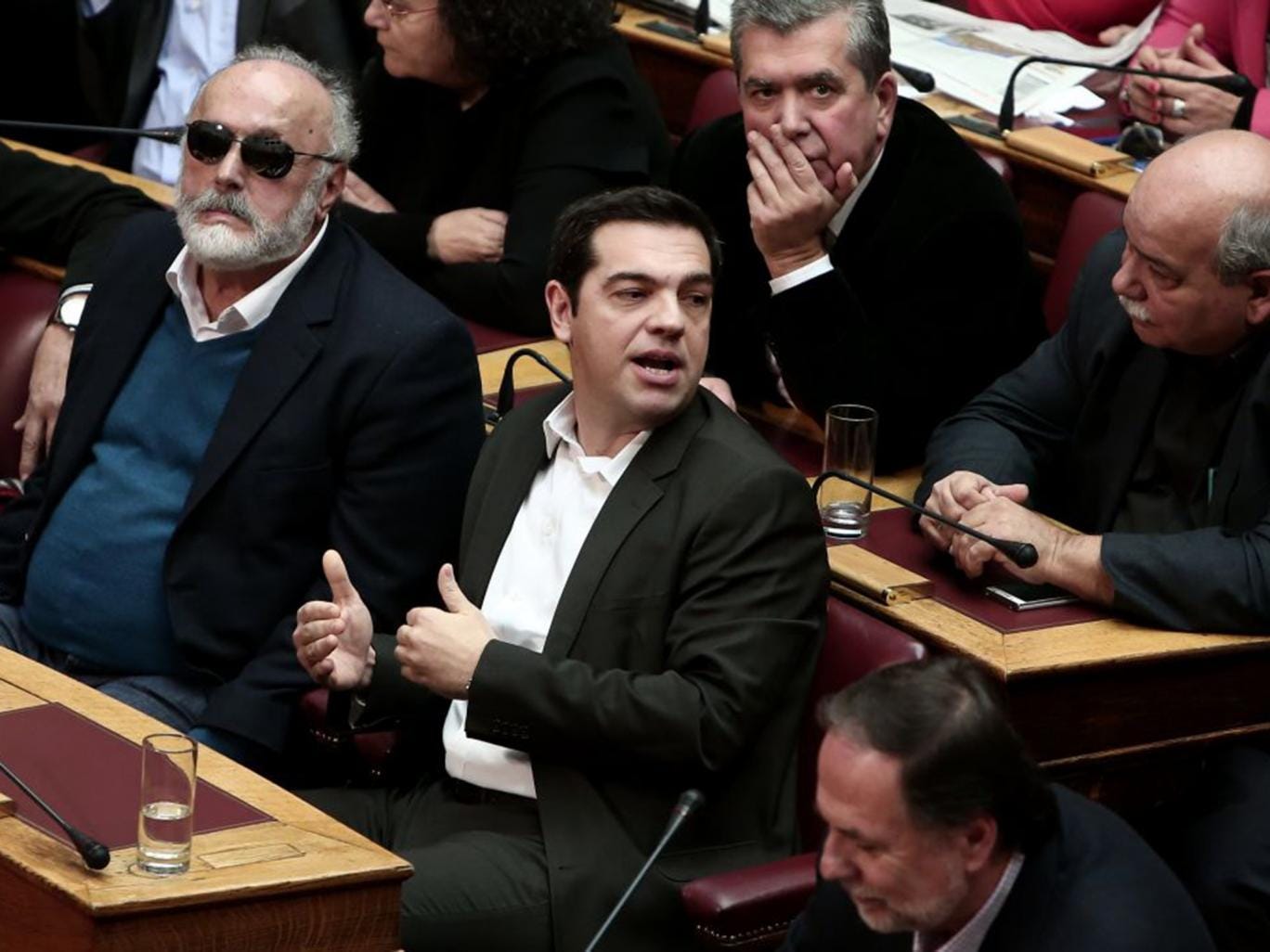 Syriza party leader Alexis Tsipras, centre, in parliament on Monday