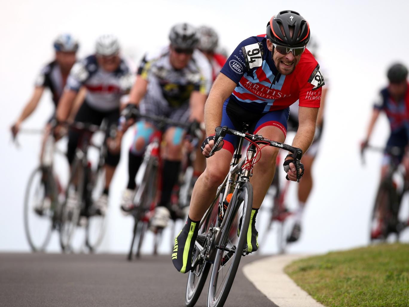 Cyclists wearing streamlined helmets 