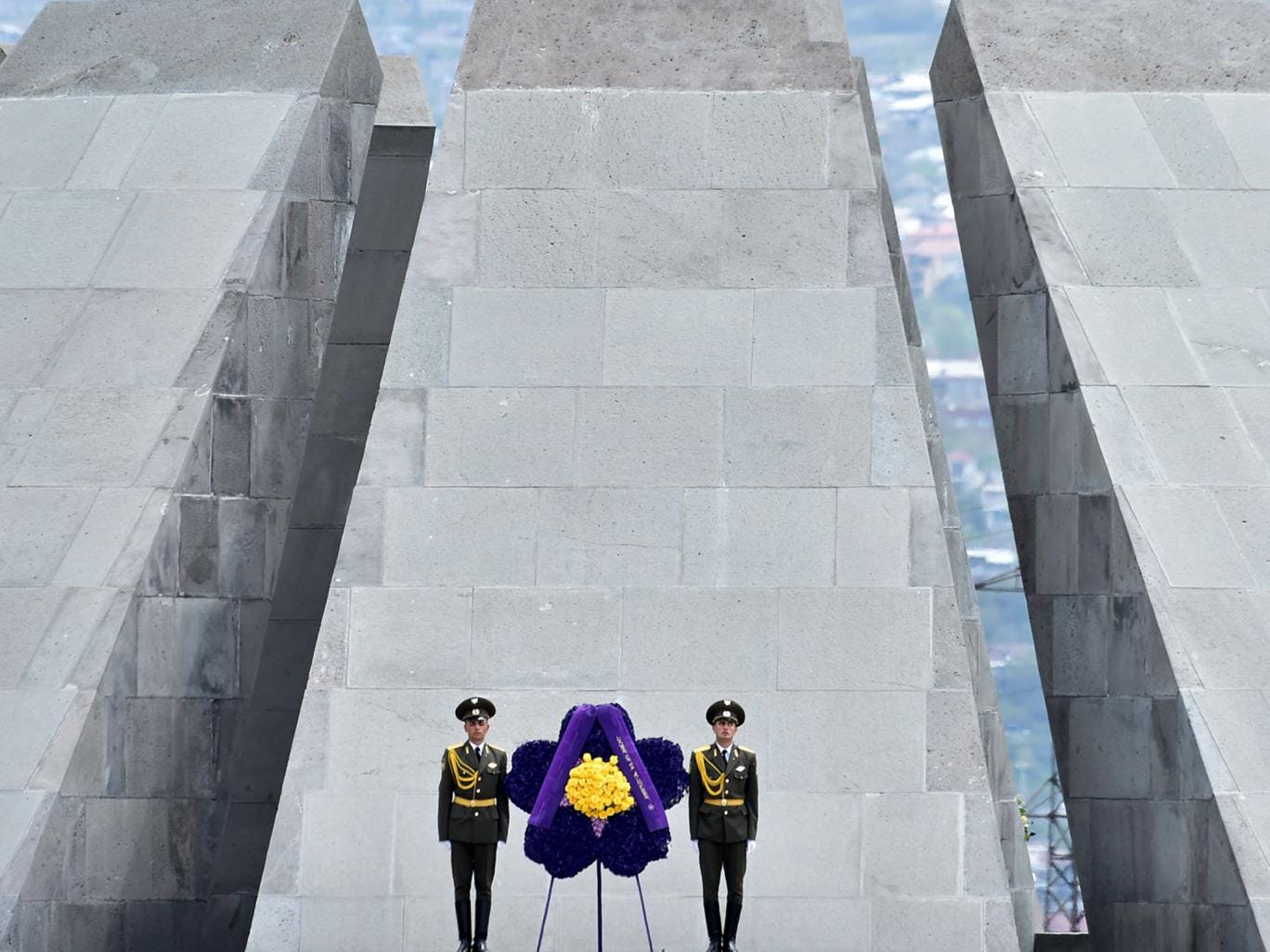 Soldiers stand guard in front of the Tsitsernakaberd Memorial in Yerevan during a commemoration ceremony for the 100th anniversary of the Armenian genocide 