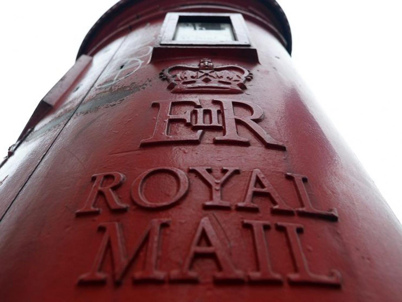 George Osborne will raise another £1.5bn by selling the Government’s remaining 30 per cent stake in Royal Mail (EPA)