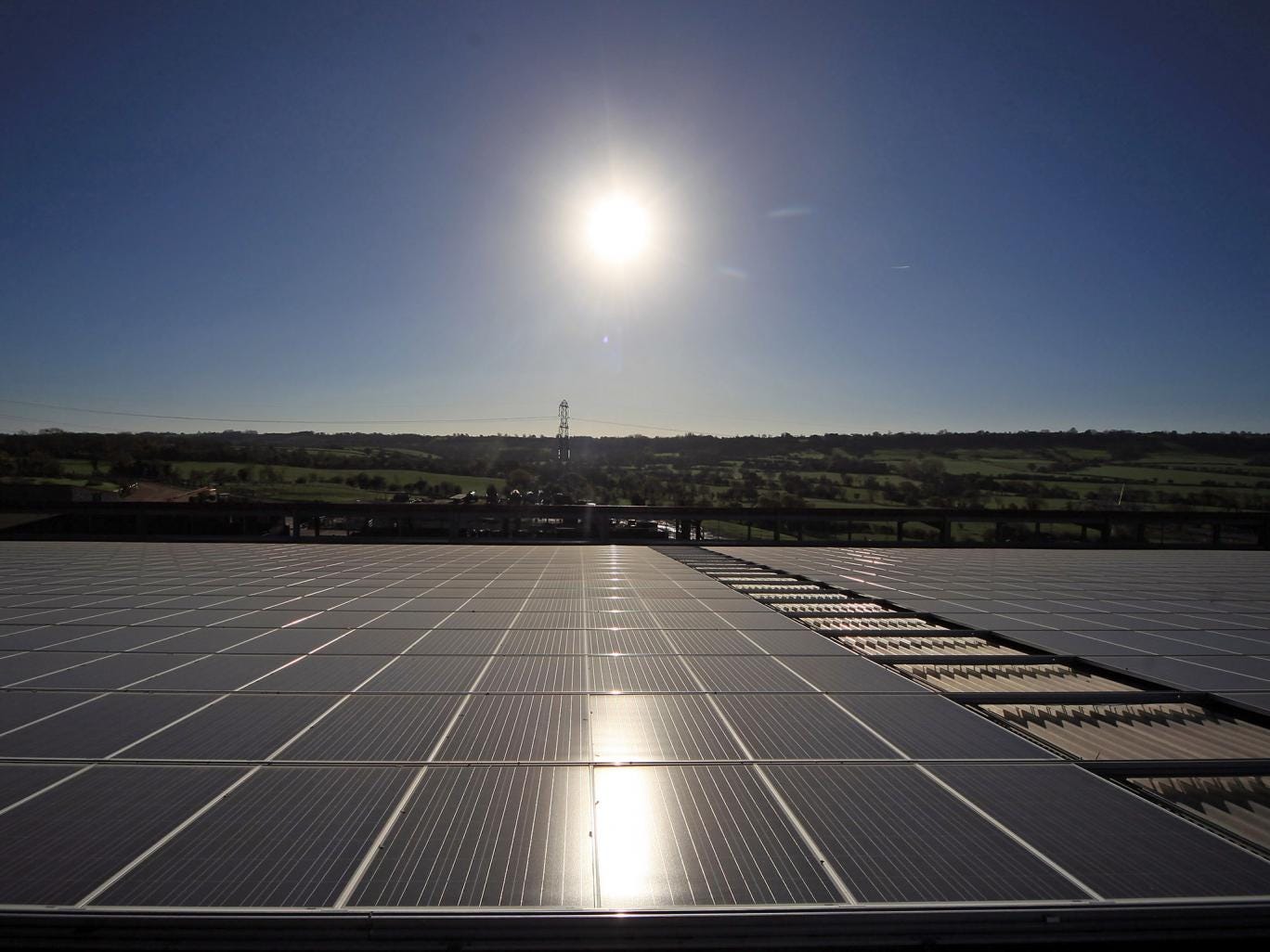 The sun shines on a solar panel system at Worthy Farm in Glastonbury