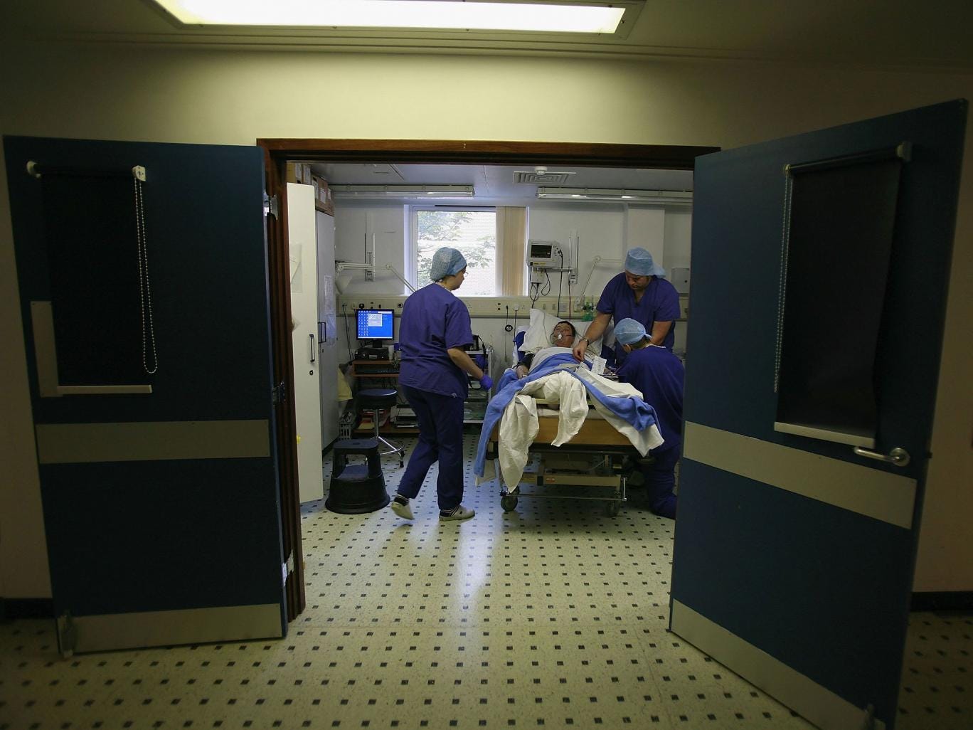 Hospitals have been told to only fill vacancies 'where essential' to save money, and been reassured they should not be fined if they miss waiting times targets, in a dramatic escalation of the NHS financial crisis